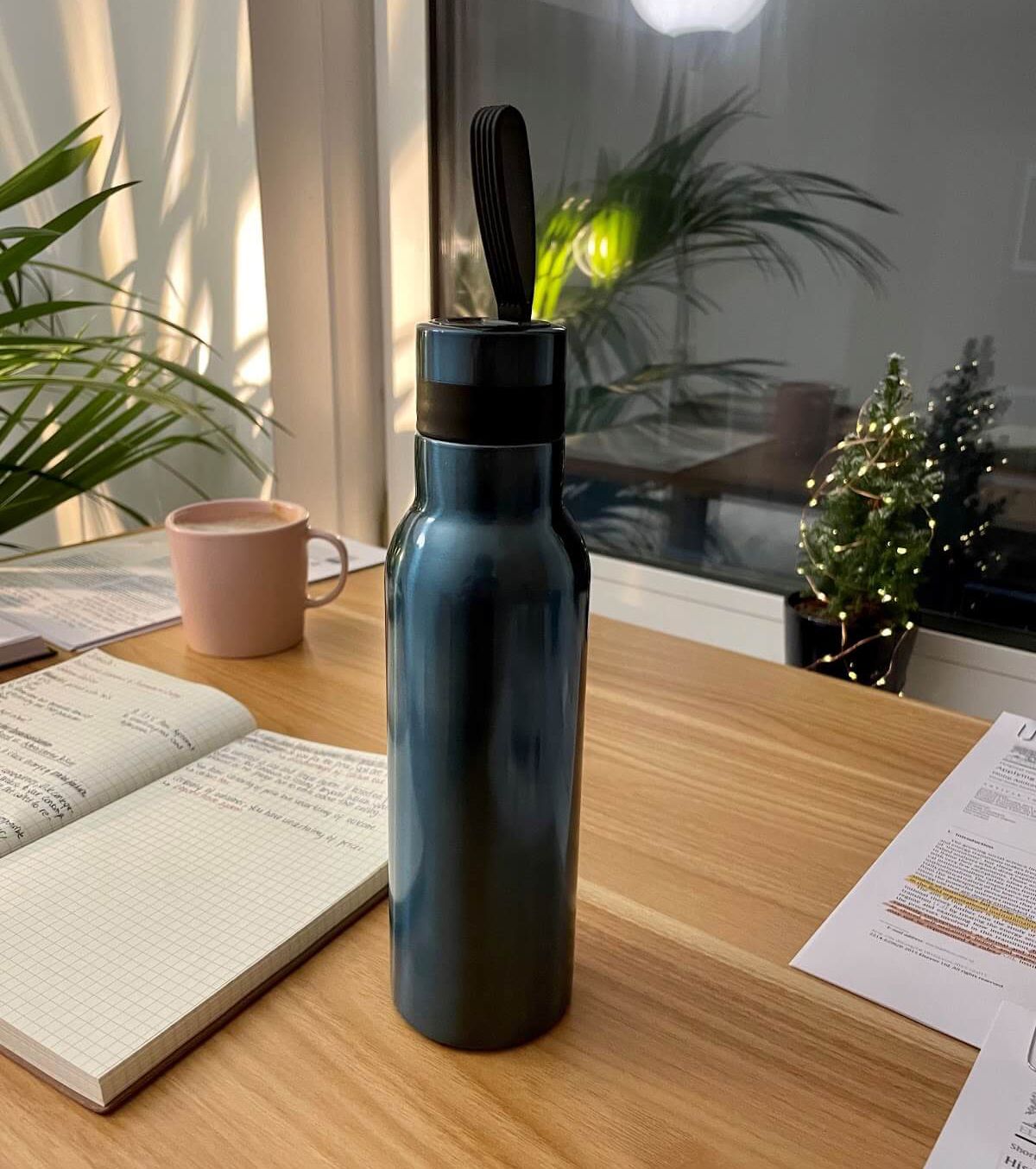 Merve's teal water bottle takes a prominent space on her desk