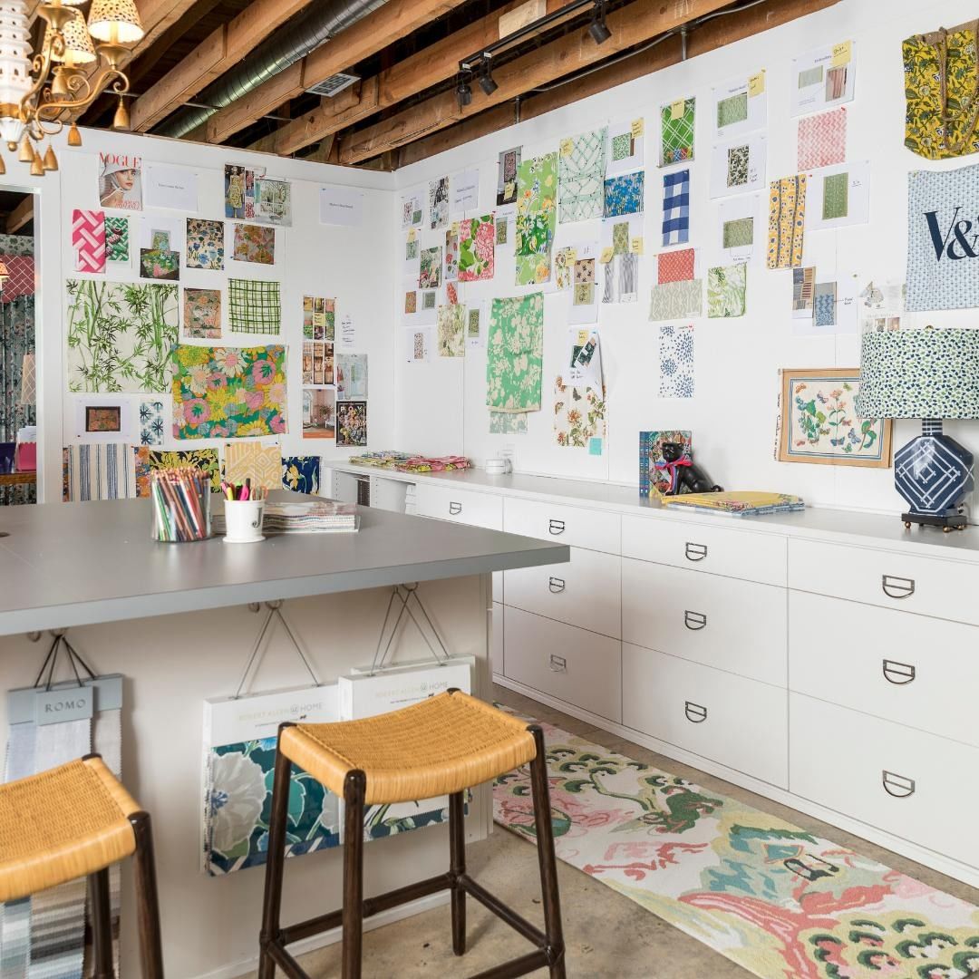 A work-from-home studio with a freestanding desk in the middle of the room