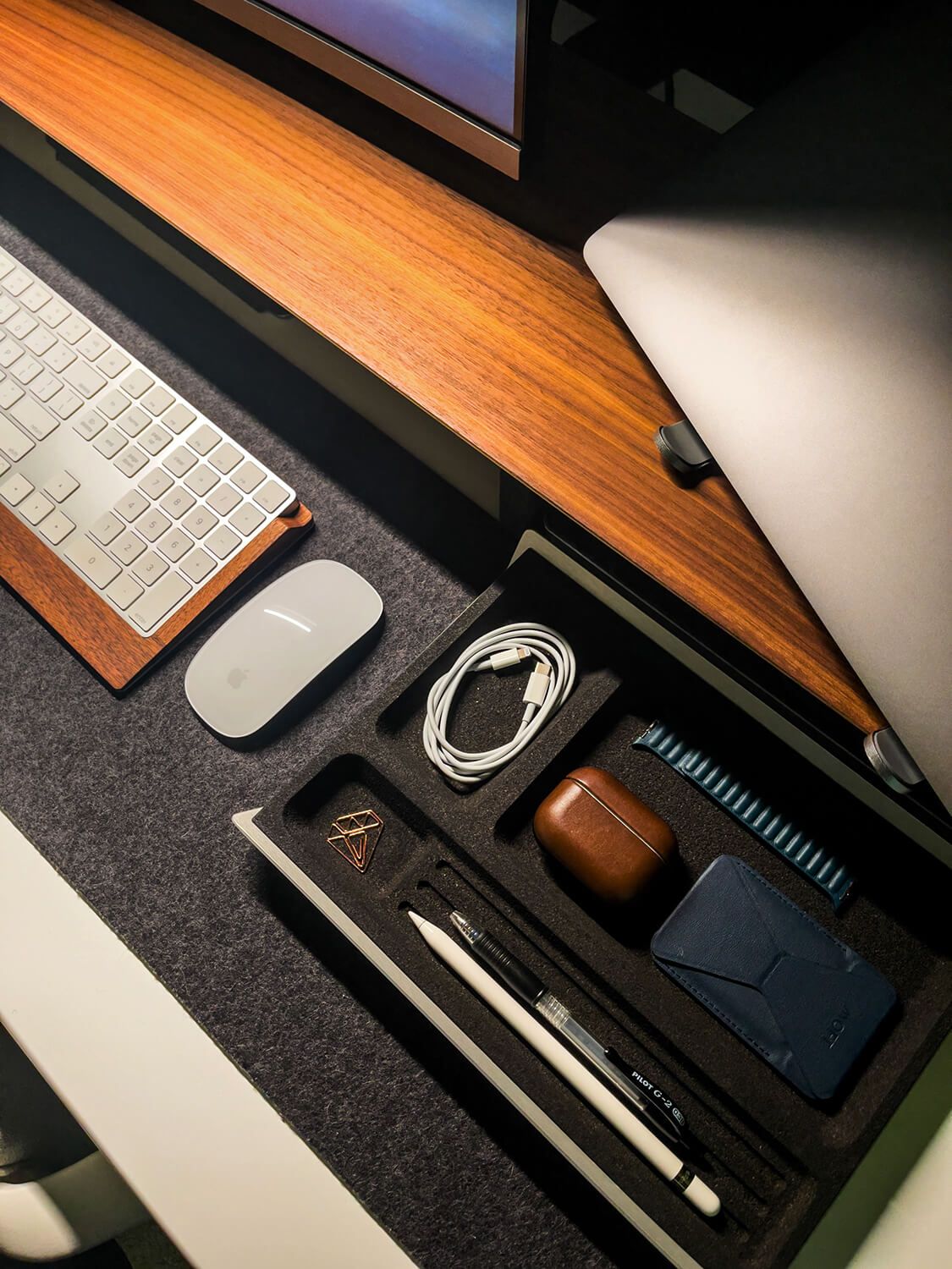 The little diamond thing in the desk tray is a small paper clip. Lizz says it's a cute accessory she has in case she needs to bundle some paperwork together.