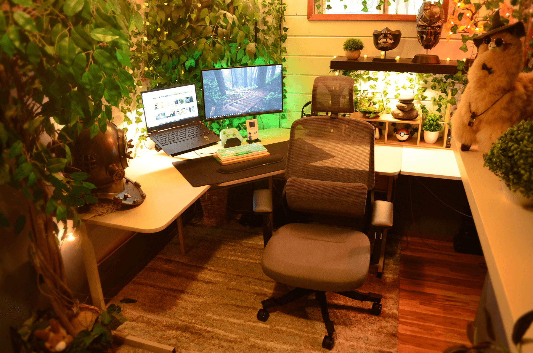 A WFH setup with lots of plants and an alpaca wearing a hat and sunglasses