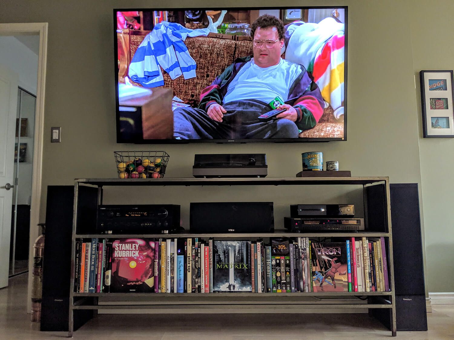 A living room with books used for cable management