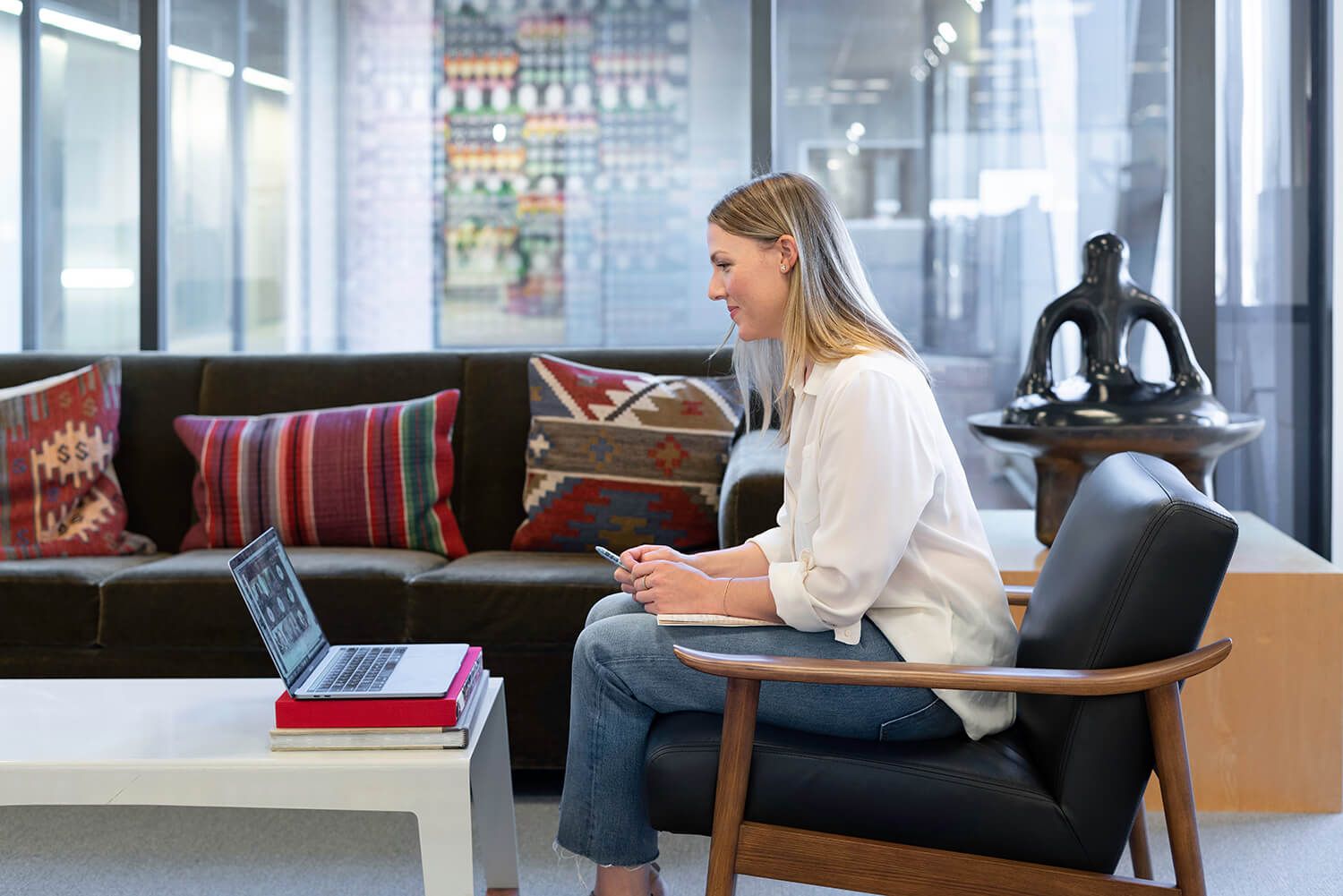 A businesswoman working in an office on a virtual call