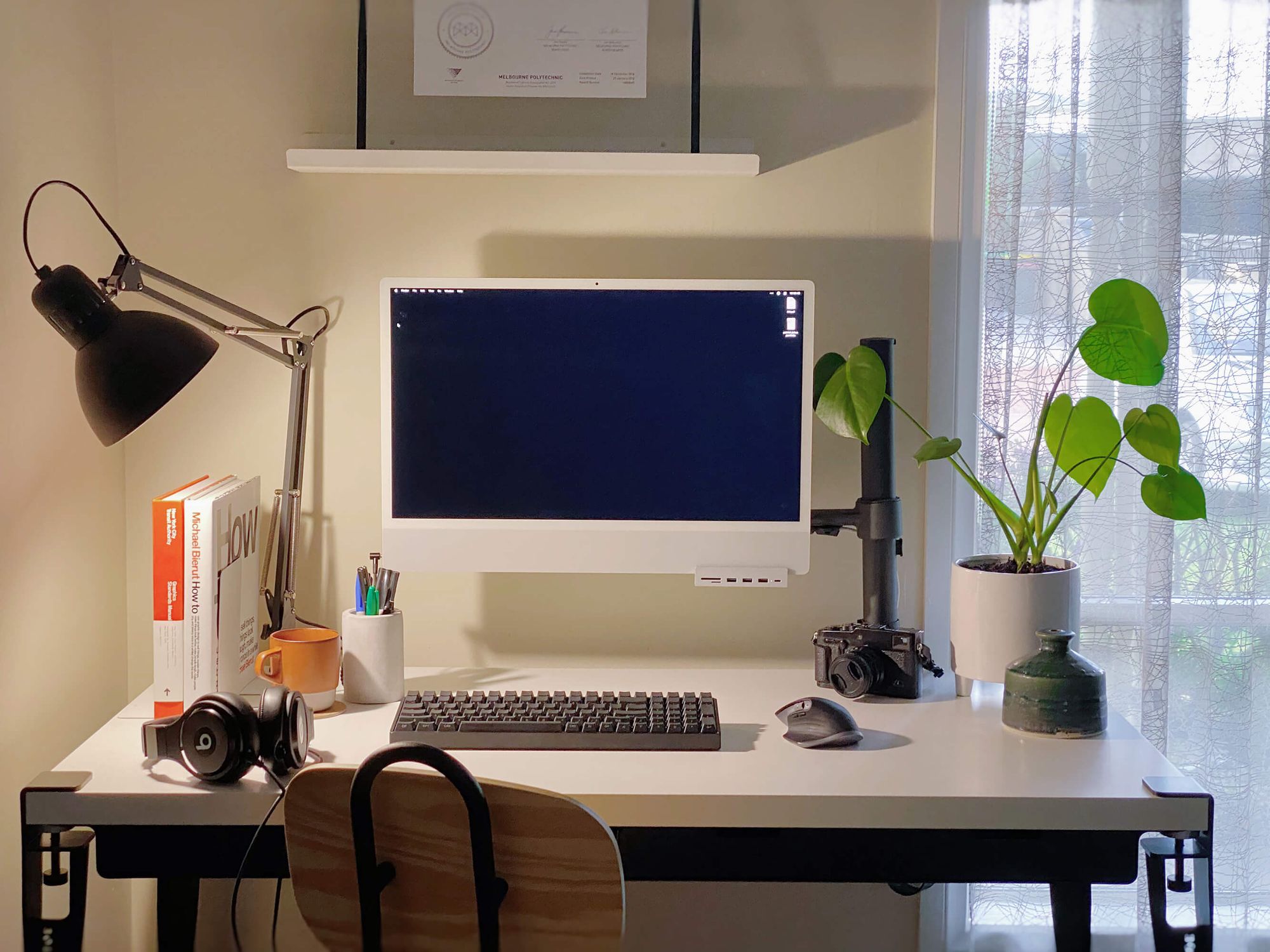A minimalist home office setup featuring the Tiptoe WAVE drawers unit and IKEA worktop