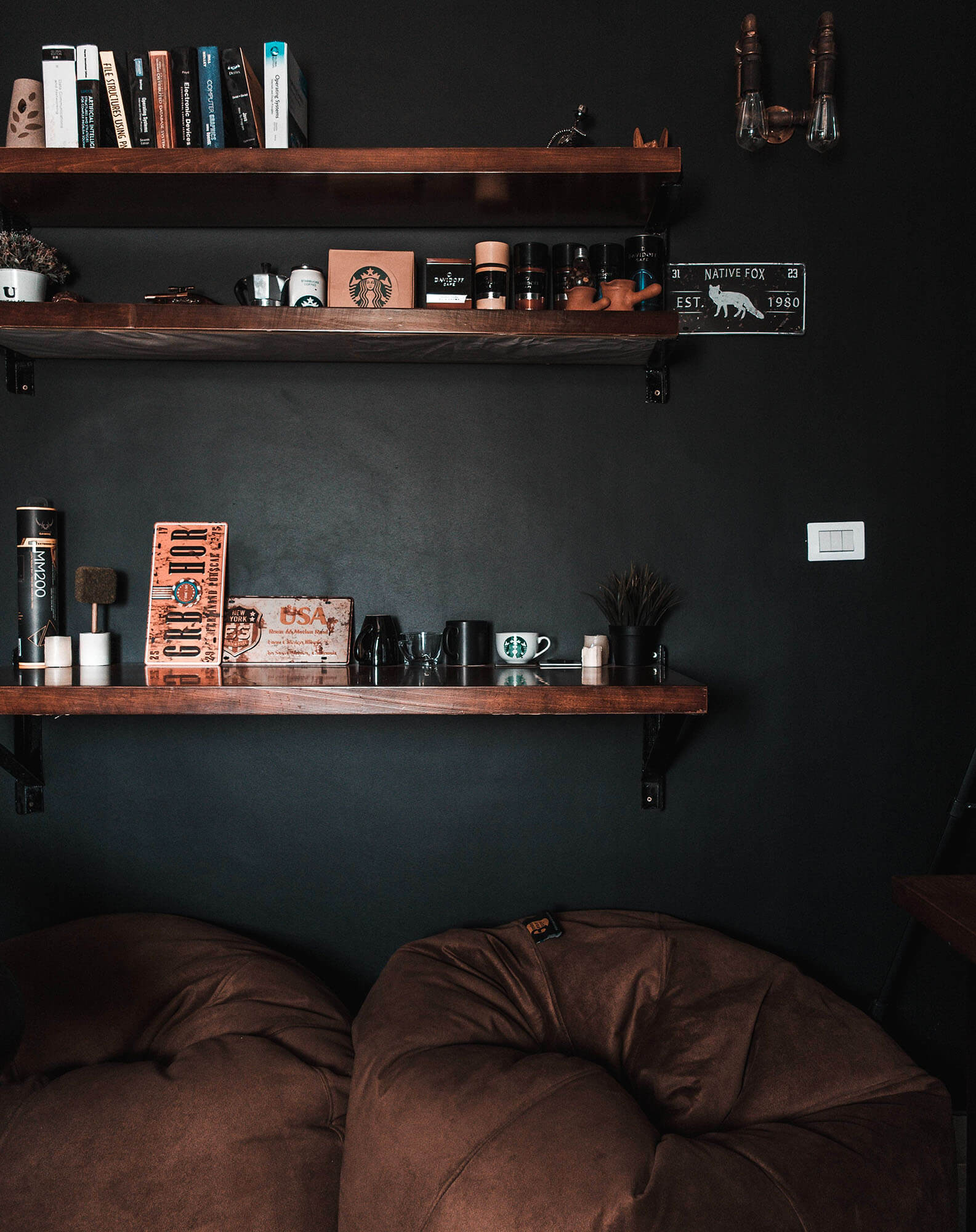 Dark wall with wooden shelves