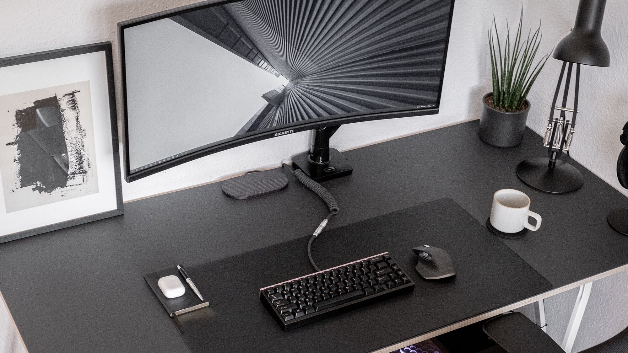 Monochrome desk setup with a Gigabyte monitor