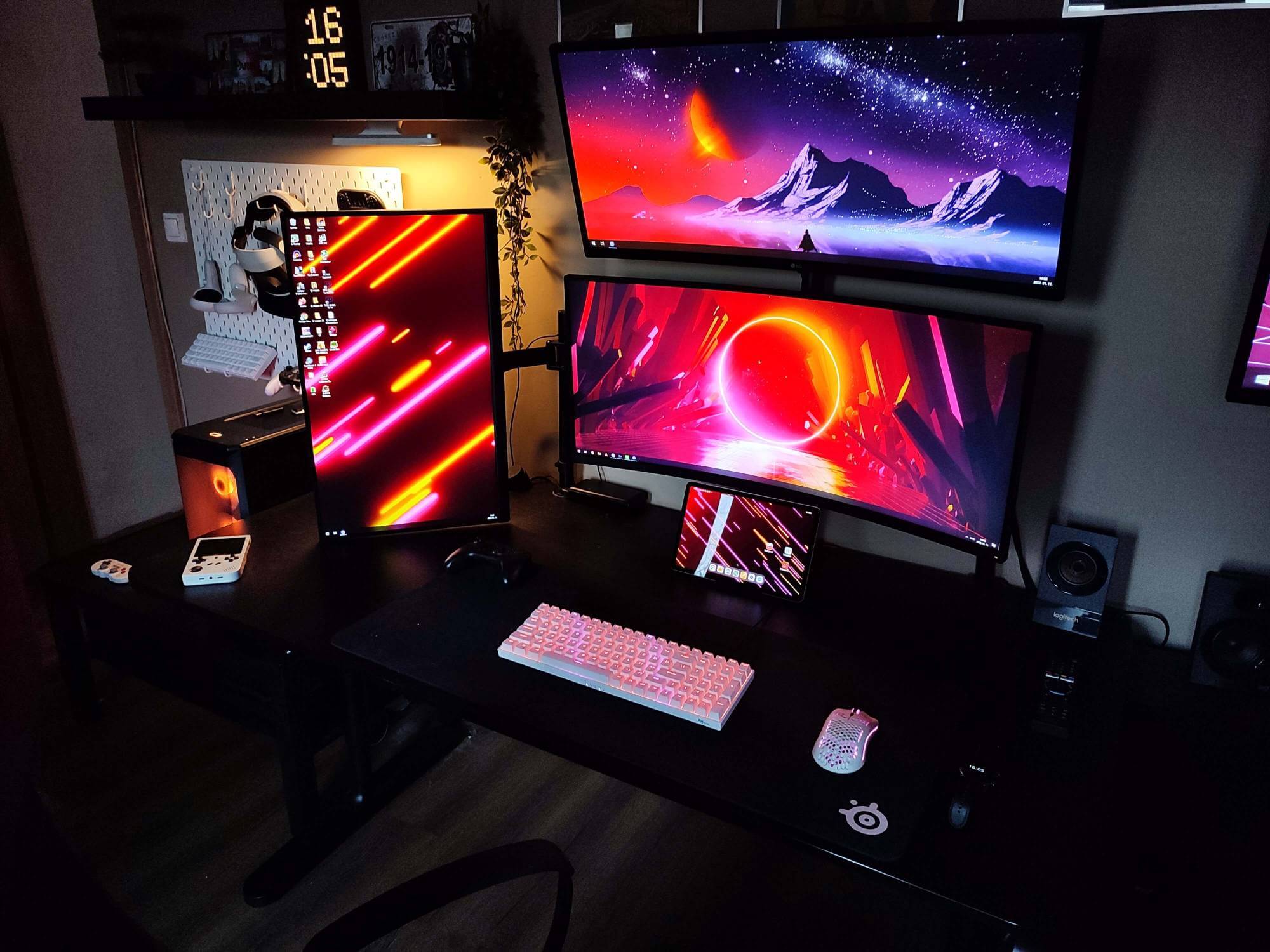 Real well-organised dark home office with multiple monitors