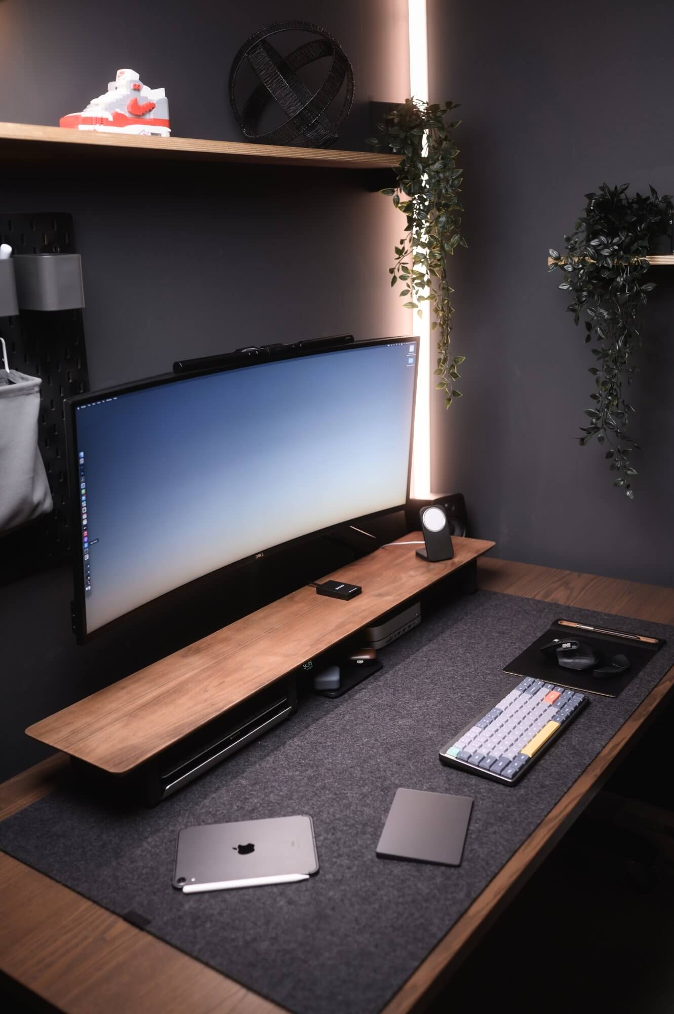 A moody desk setup with walnut vibes