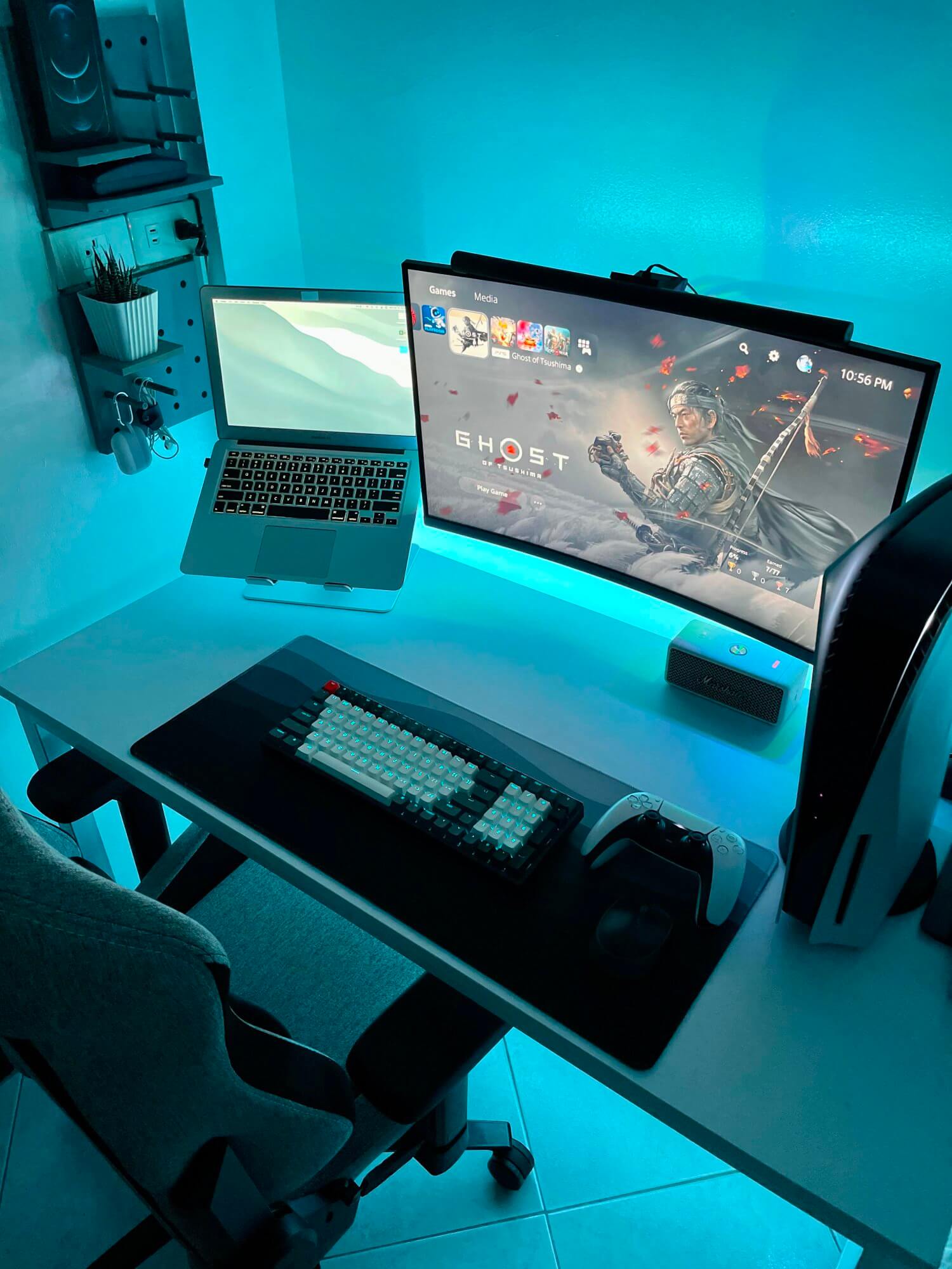 Gaming desk setup featuring the Ghost of Tsushima: Legends video game on a screen