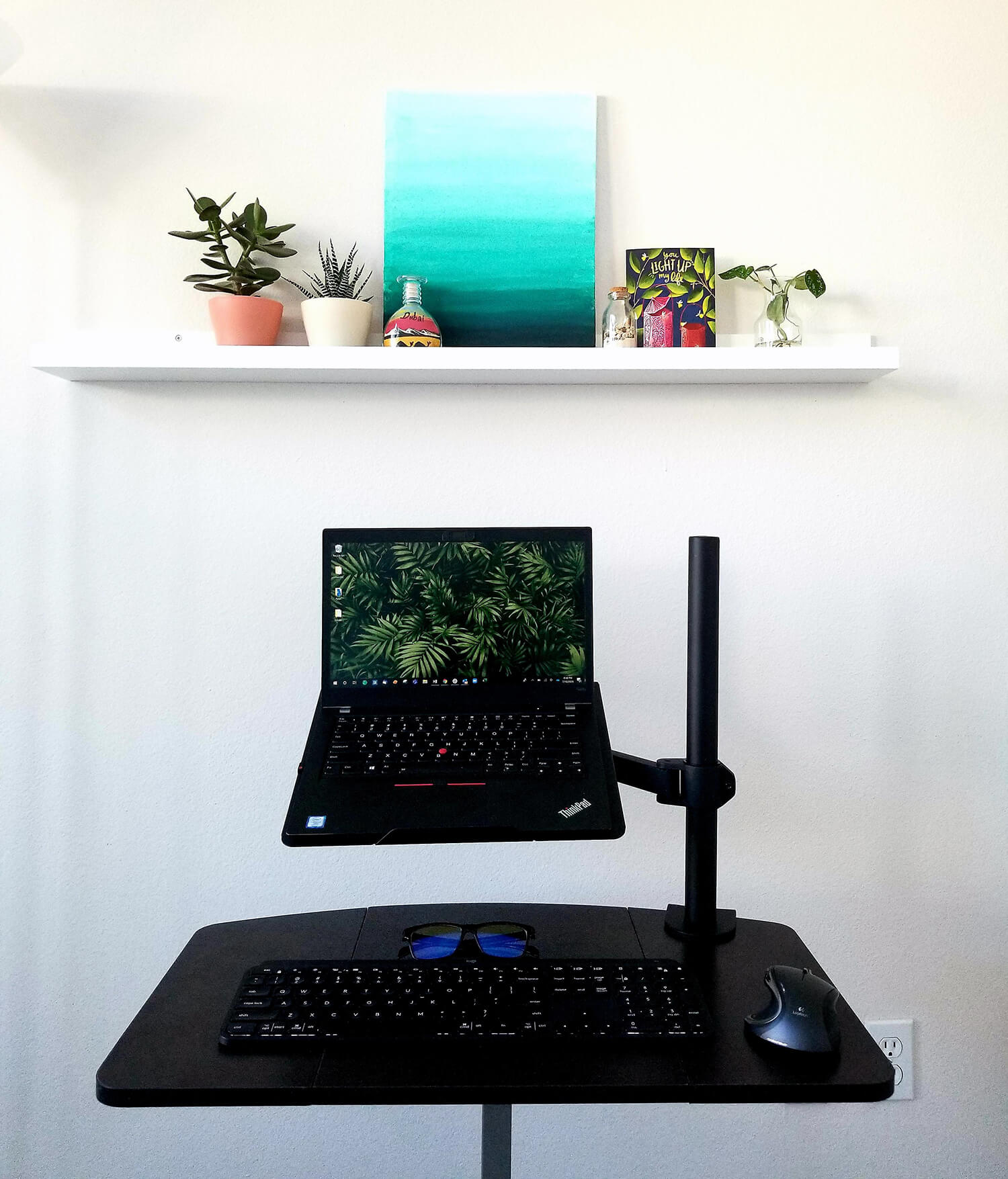 Make-shift WFH desk setup with a portable desk and laptop stand