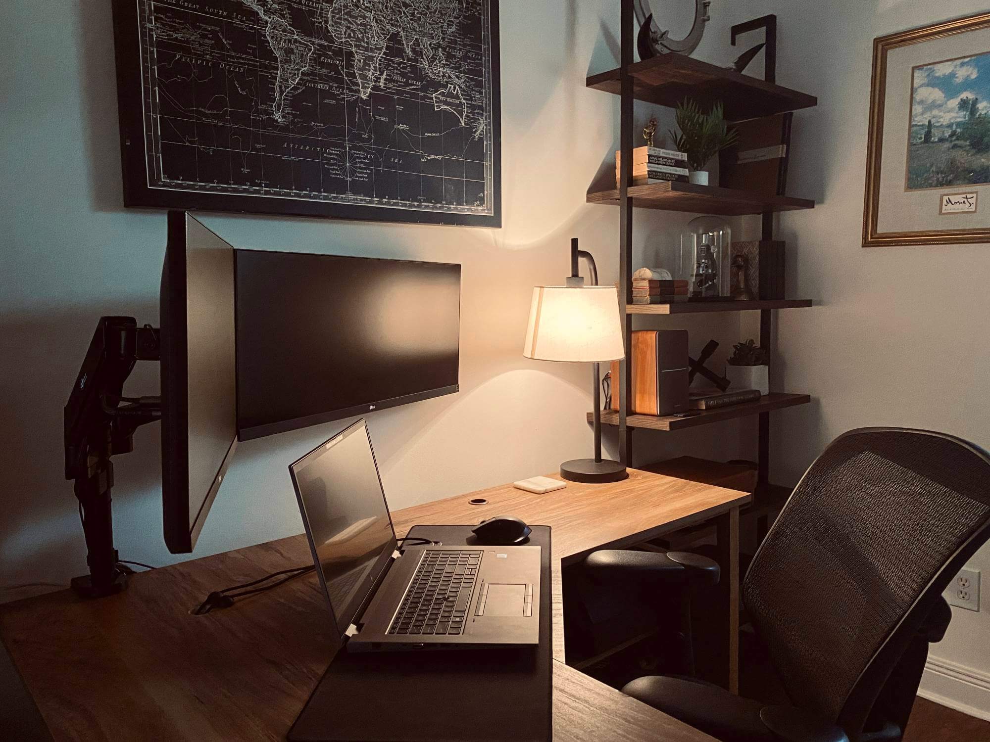 An L-shaped desk setup of a civil engineer featuring dual monitors