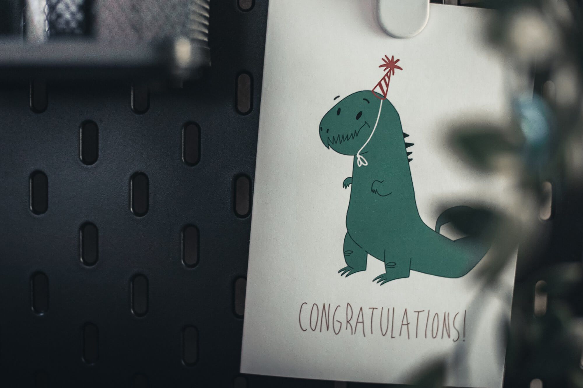 A birthday card with a little dinosaur
