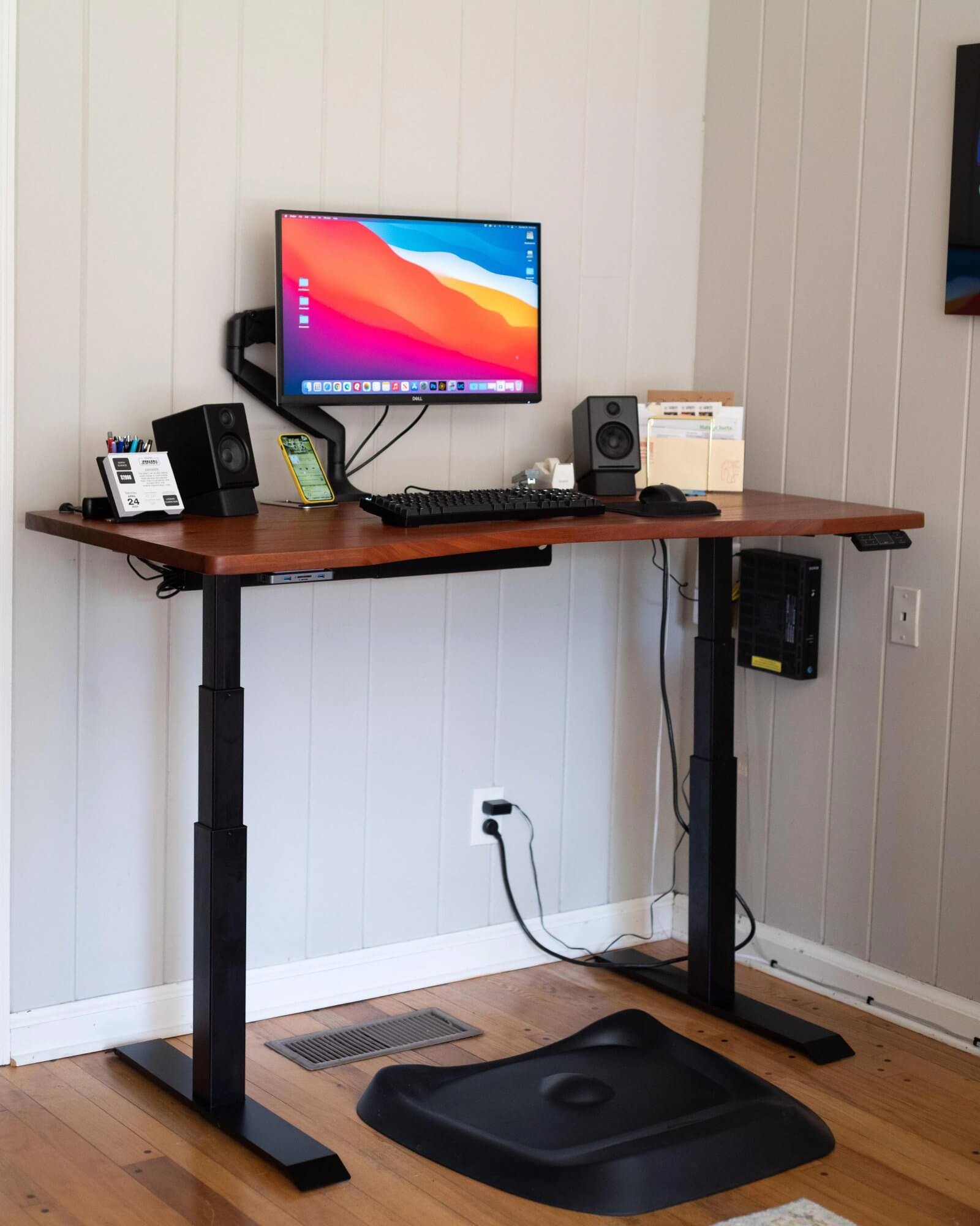 The Deskhaus Summit sit-stand desk with a mahogany top