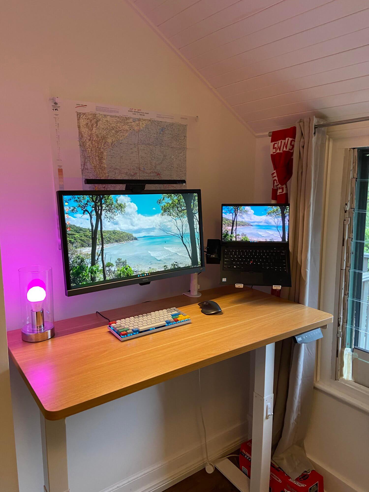 A home office setup featuring an Artiss standing desk