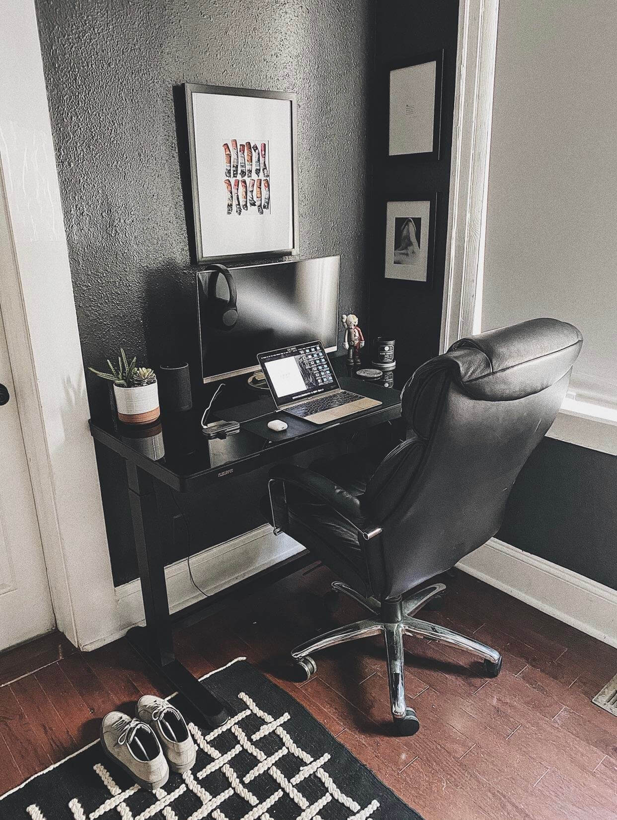 A home workspace featuring a Flexispot Standing Desk