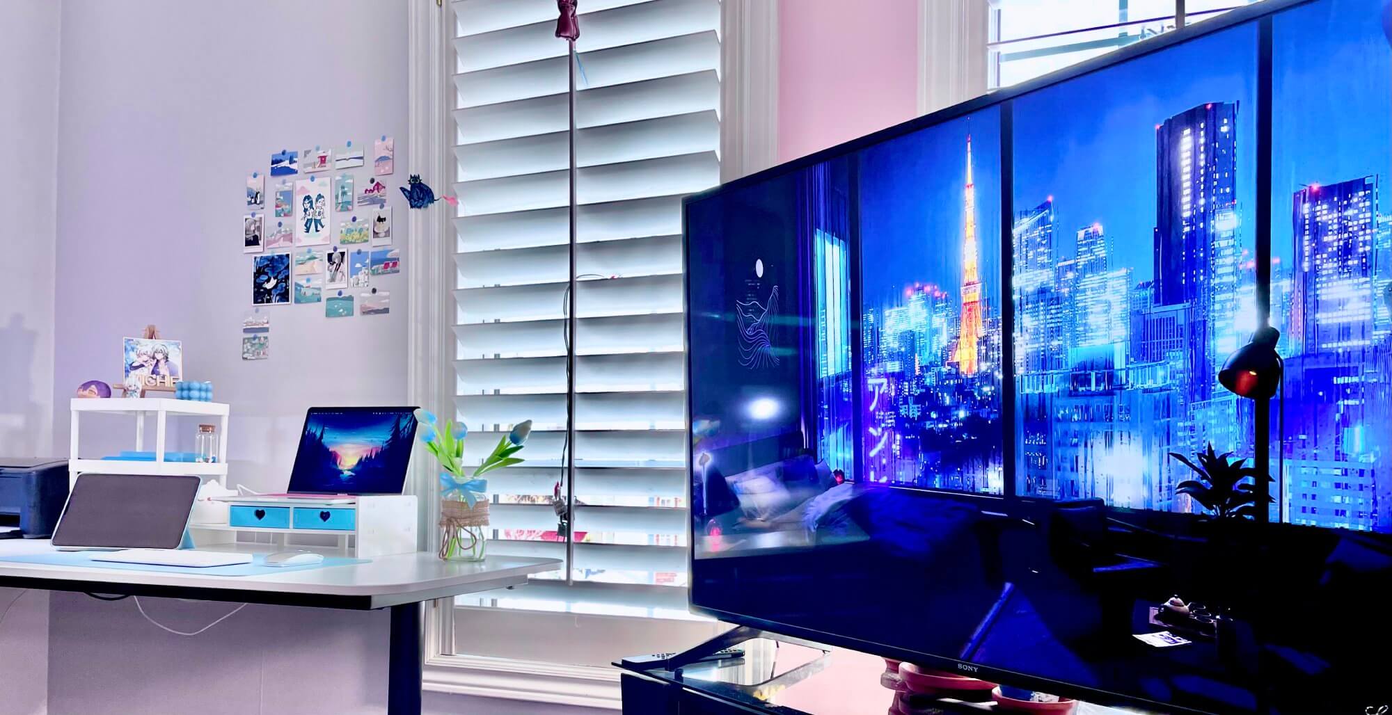 A 55″ Sony Bravia TV and a blue-themed workspace