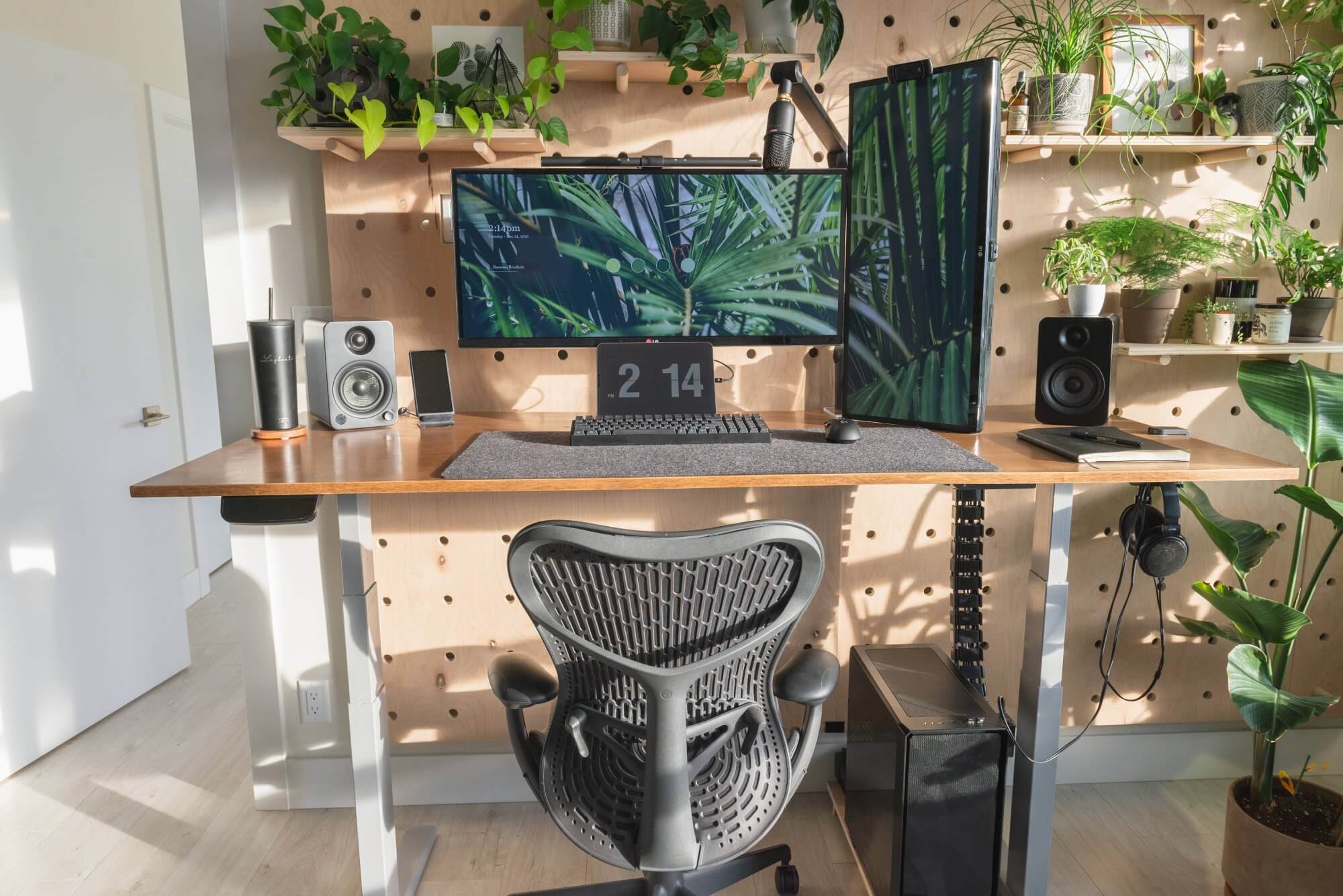The botanical workspace with a pegboard wall