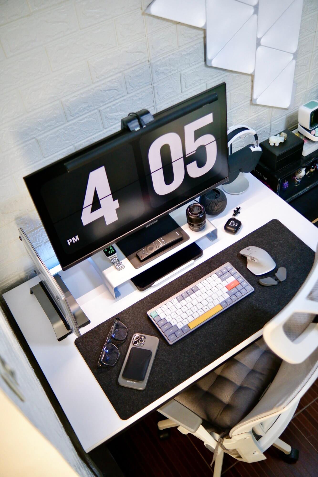 Small black and white workspace with a foldable desk