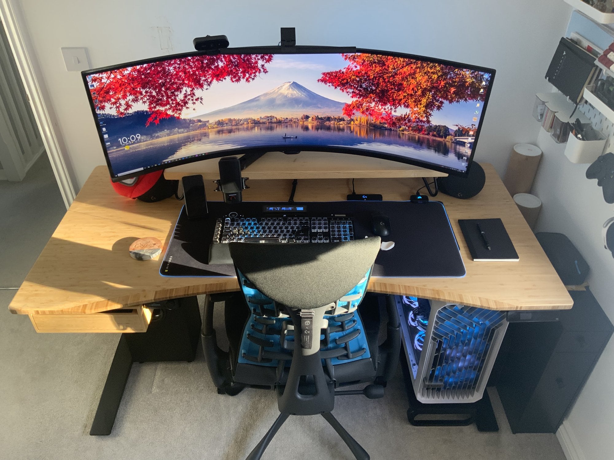 An ultrawide battlestation featuring Jarvis bamboo desk from Fully