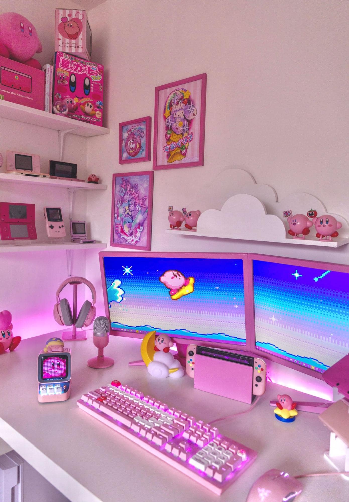 A pink dual monitor desk setup