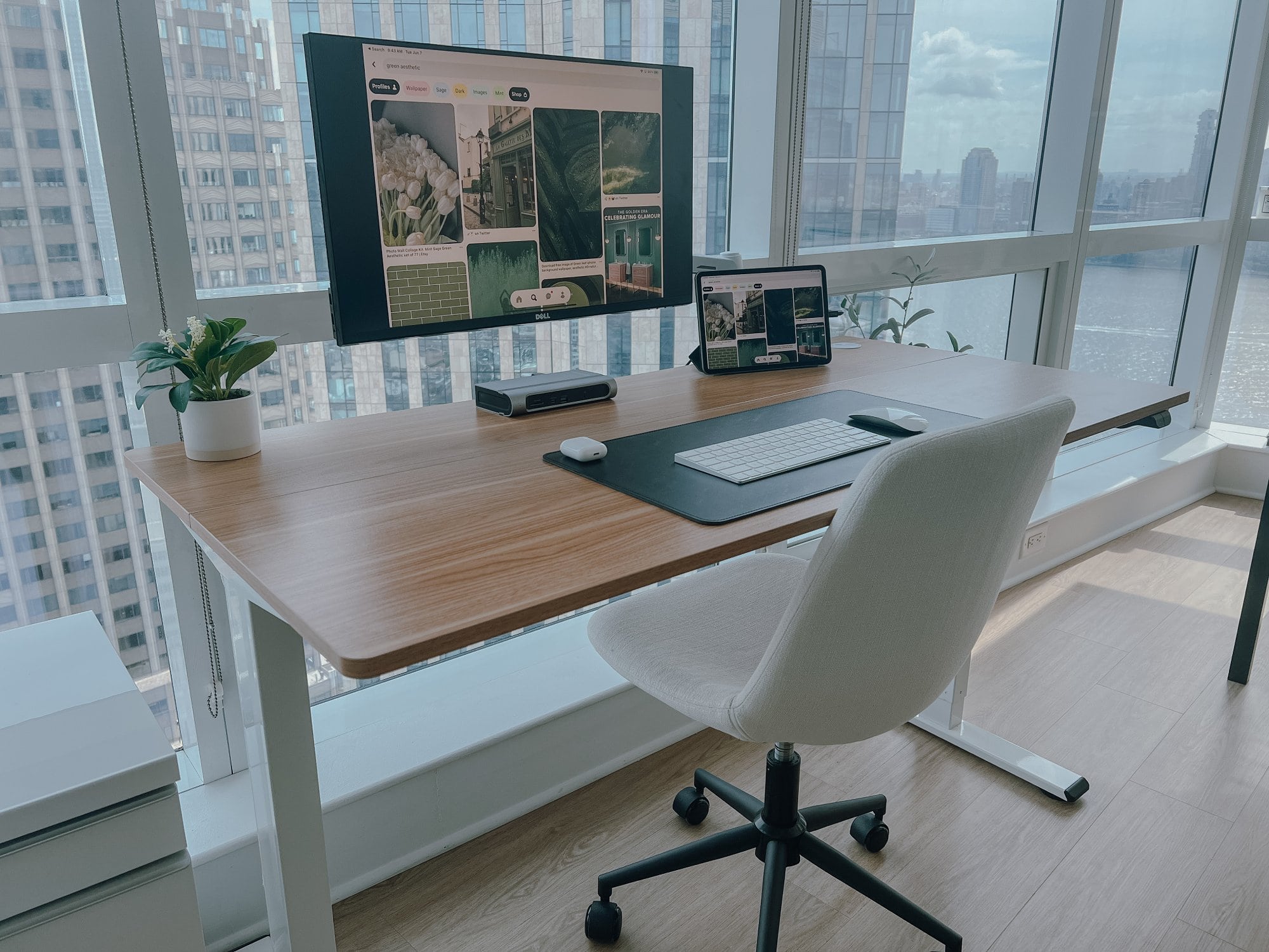 A well-organised workspace featuring a Flexispot standing desk