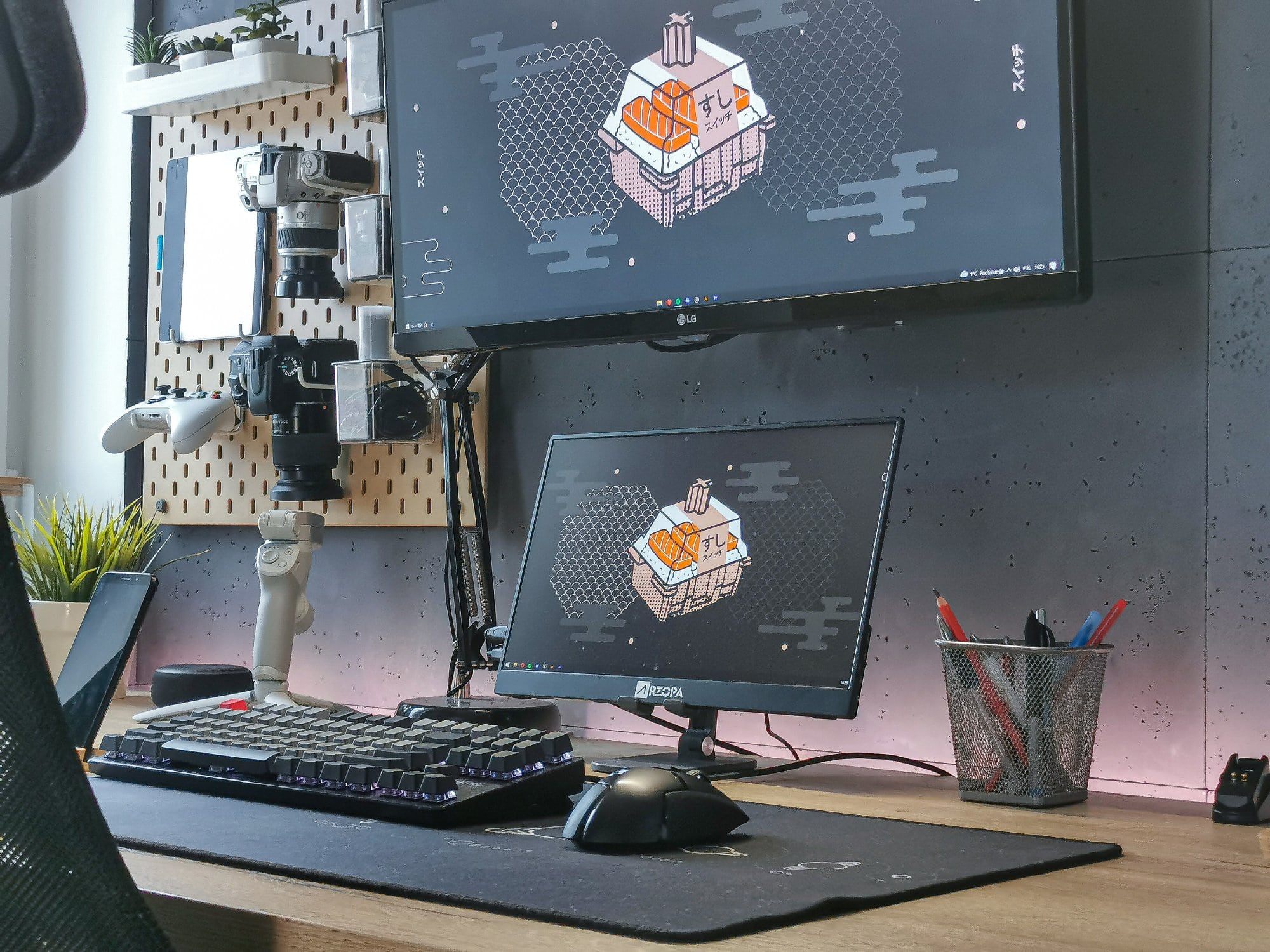 A clean and well-organised desk setup in the dark colour scheme