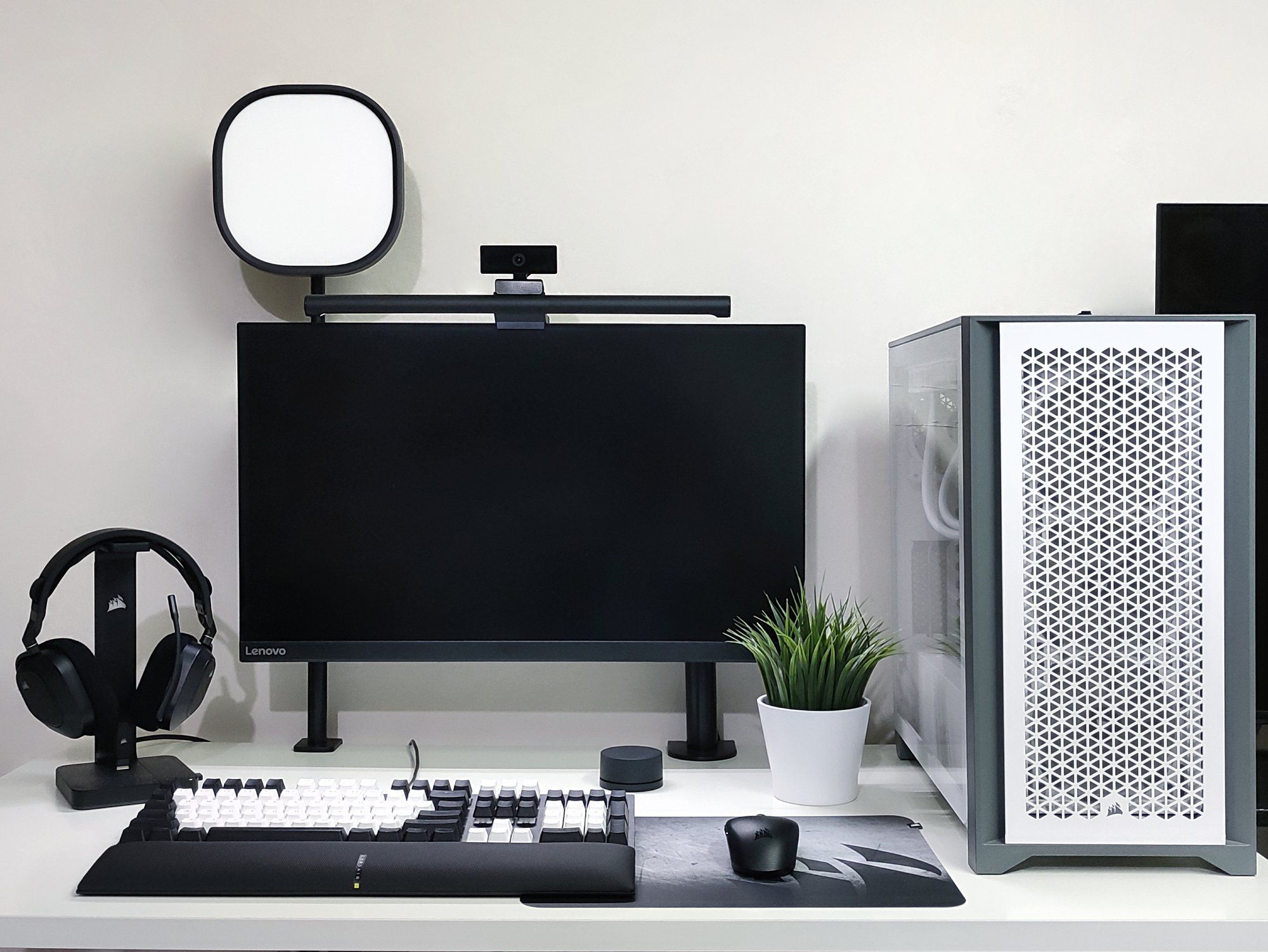 A monochrome black and white desk setup