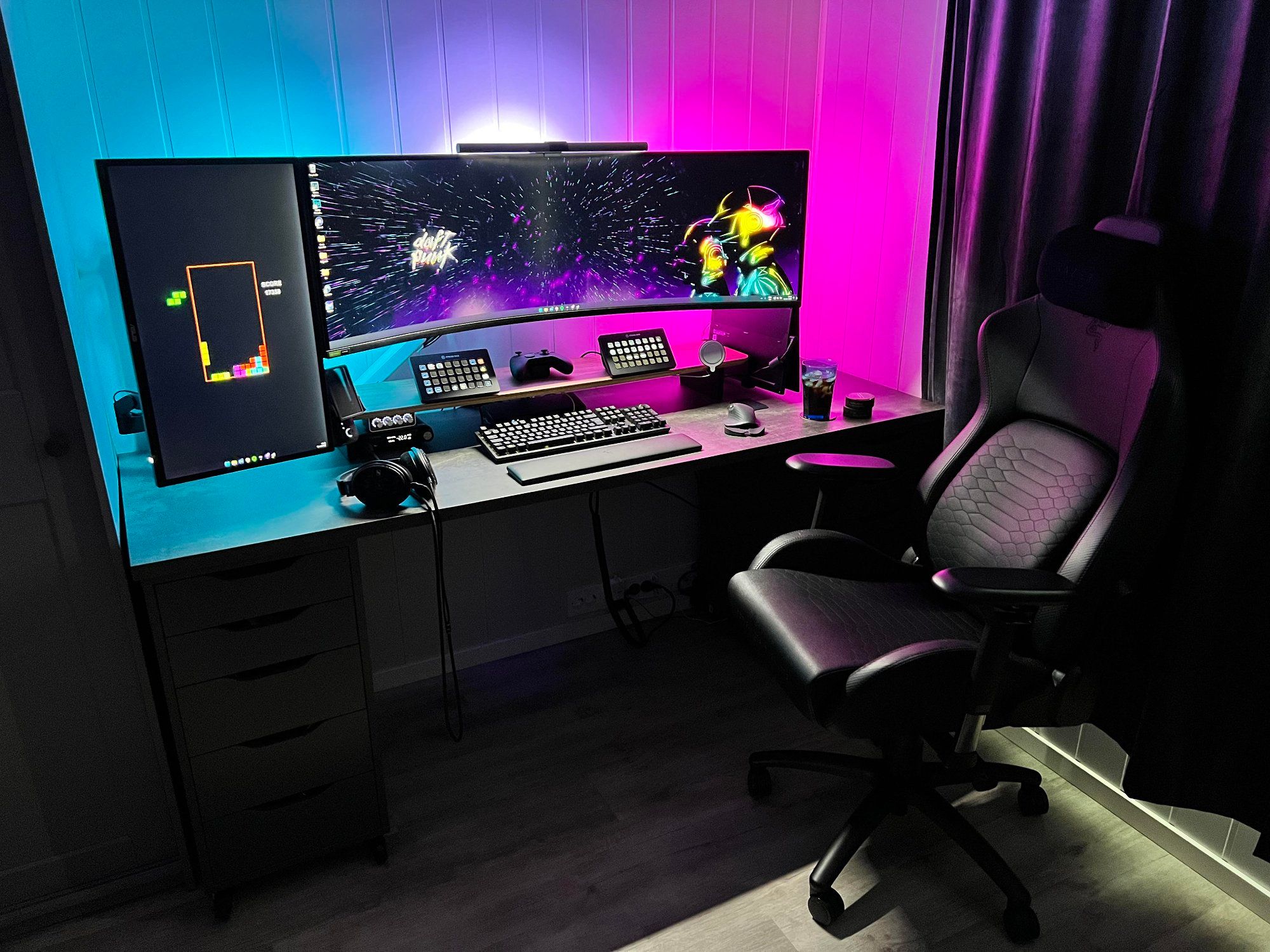 An ultrawide screen desk setup with moveable ALEX castors