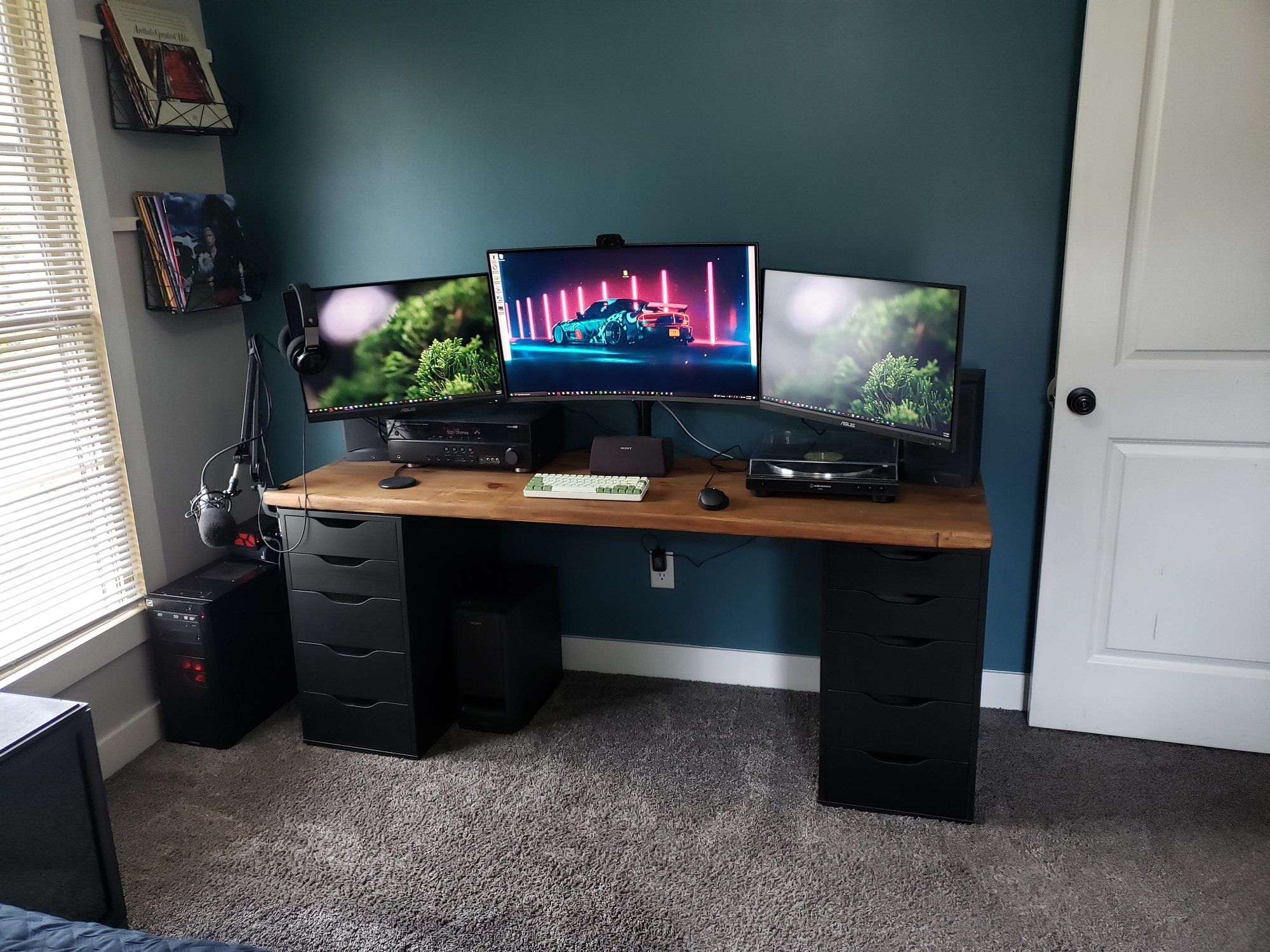 Black ALEX drawers desk setup with three monitors