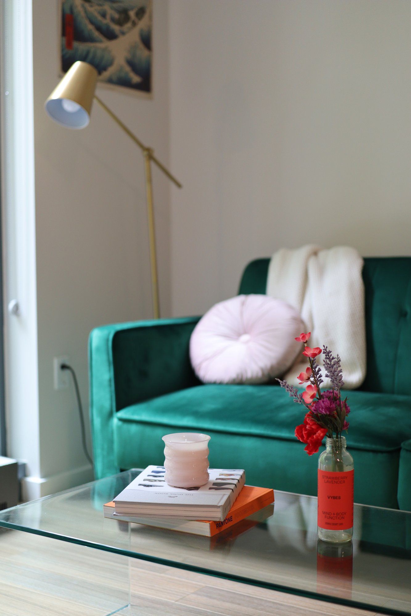 A coffee table with a vase and a couple of books