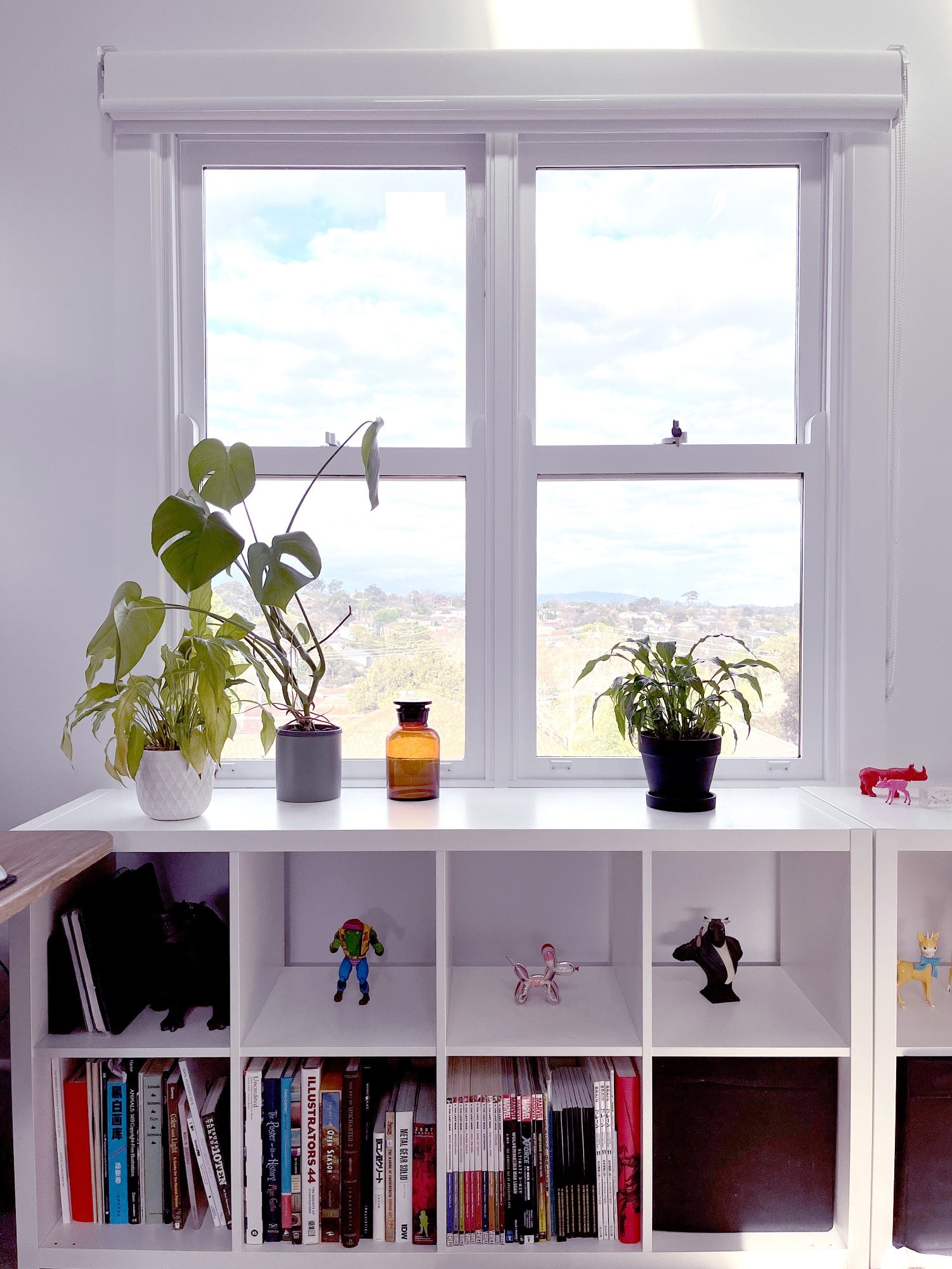 A window in a home office overlooking the mountains