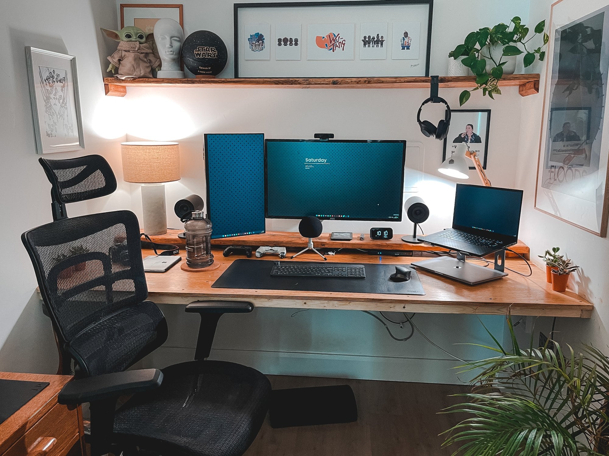 A three-monitor DIY workstation made out of plywood and scaffolding boards