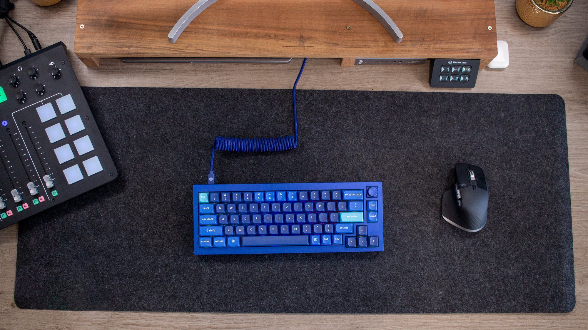 A custom blue mechanical keyboard and a Logitech mouse