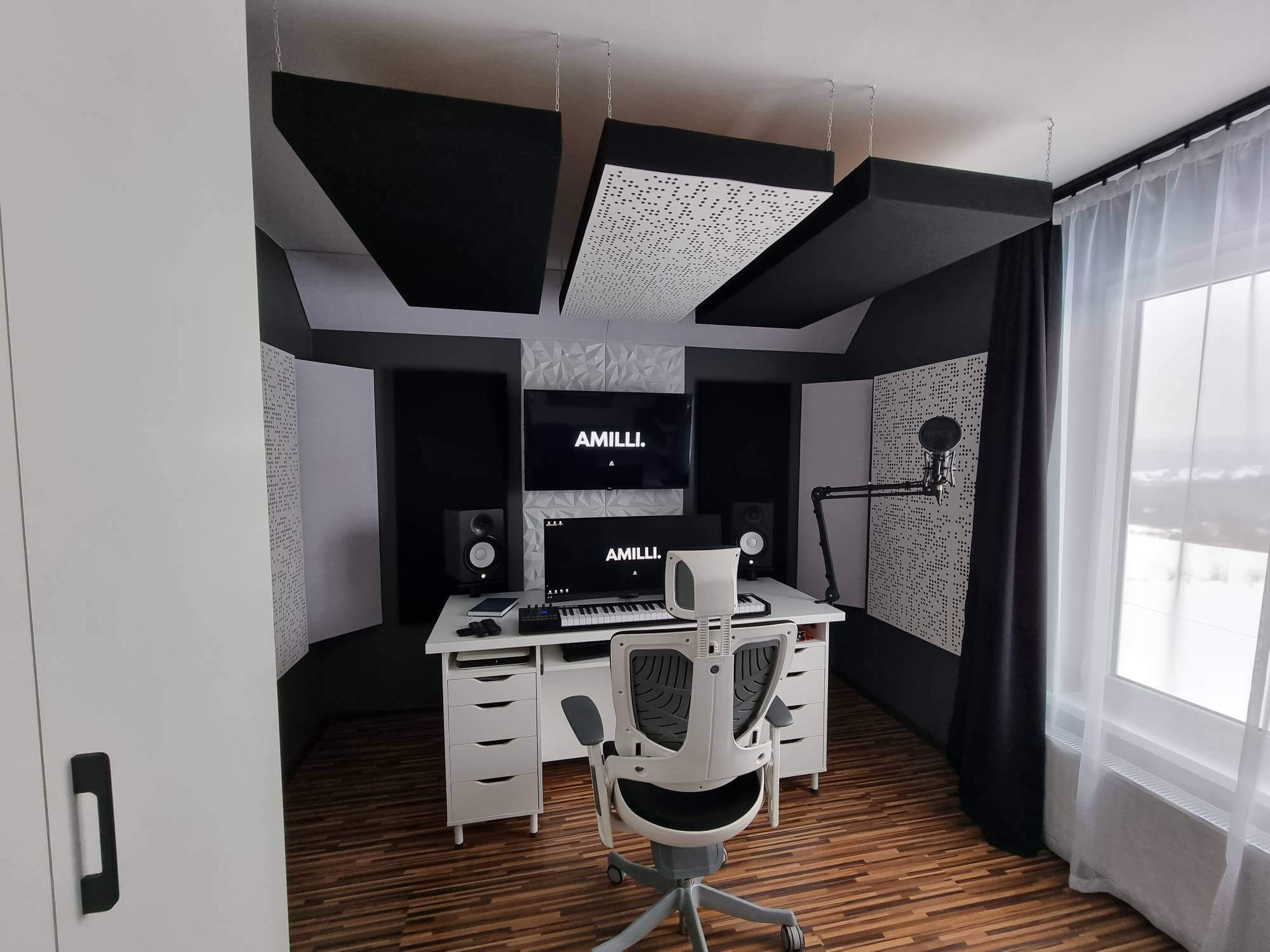 Minimalist music production desk setup with custom-made acoustic panels in Kraków, Poland