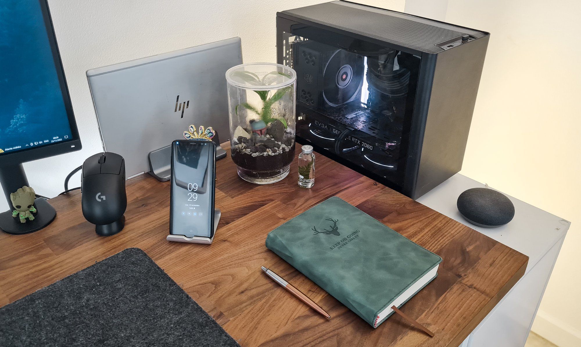 An IKEA desk setup in France filled with personal items, such as plants, figurines and stationery