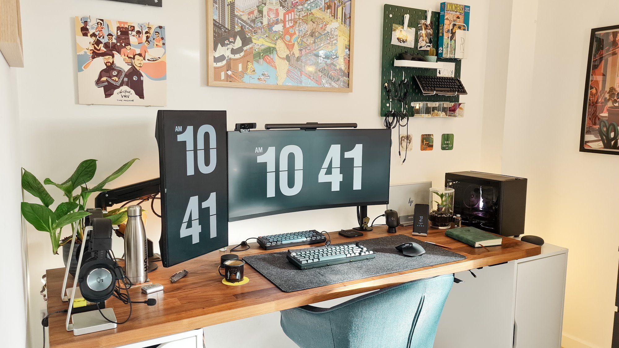 A cosy desk setup featuring one horizontal and one vertical monitor