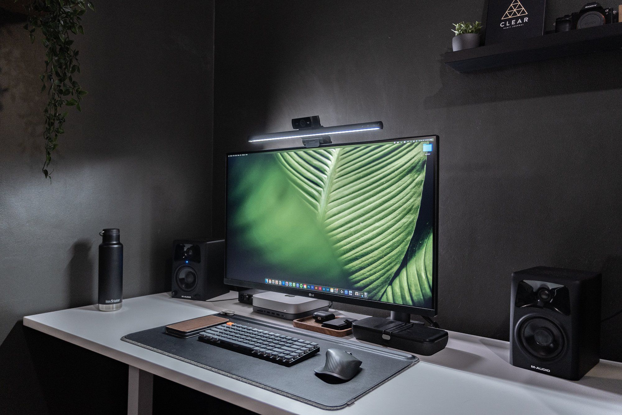 A black and white minimal desk setup fully equipped for work-from-home