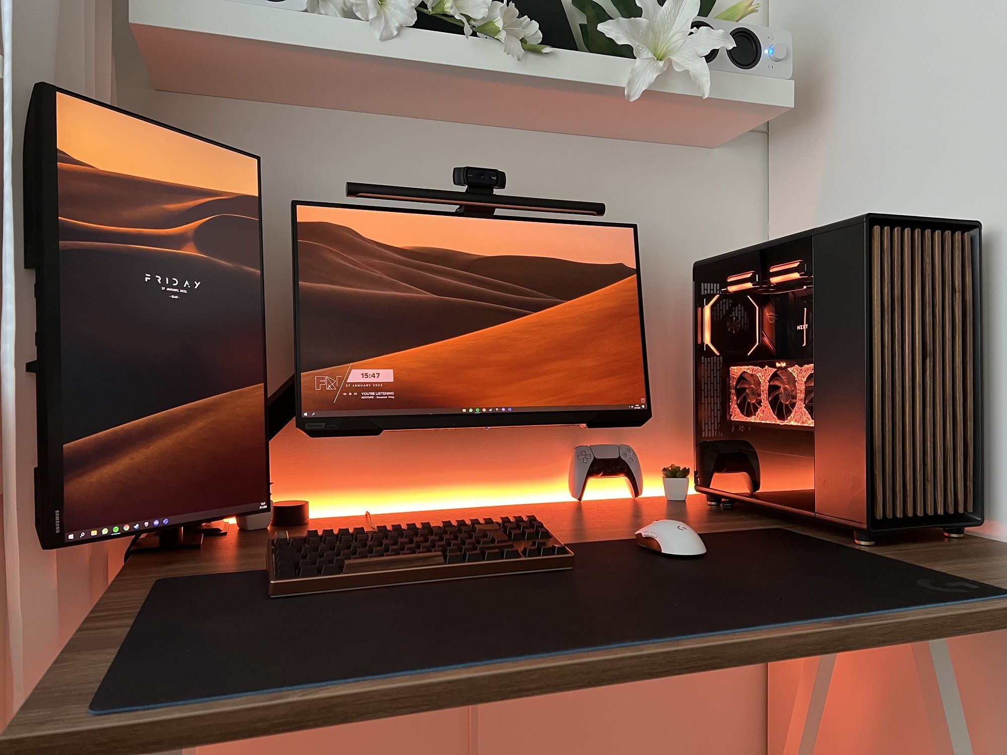 A clean and minimal home desk setup with two monitors, Samsung Odyssey G5 and Samsung T35F