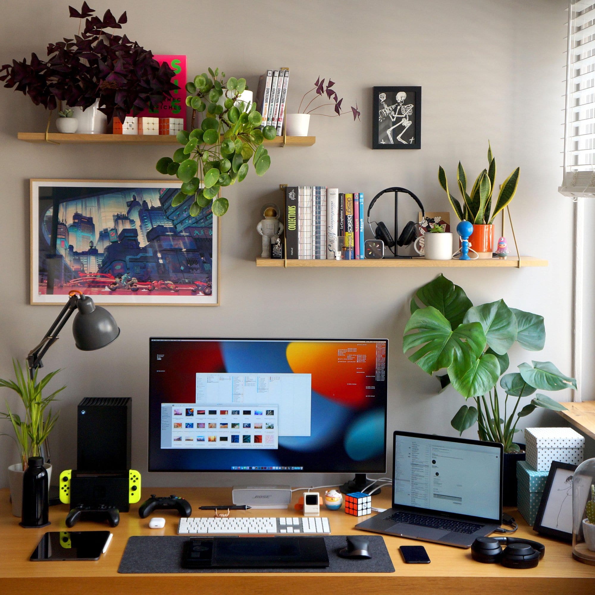 A colourful plant-filled graphic design home office in France