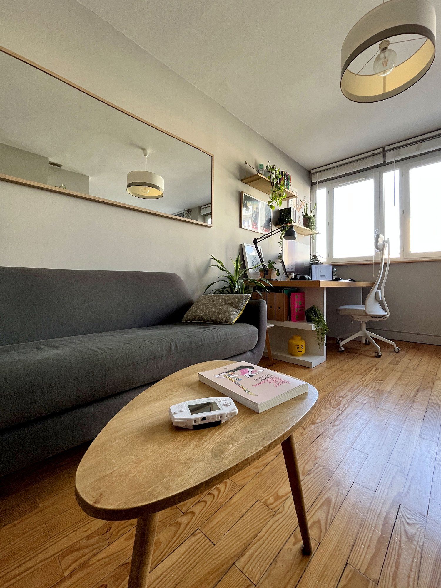 A reading and video gaming spot next to the WFH desk setup