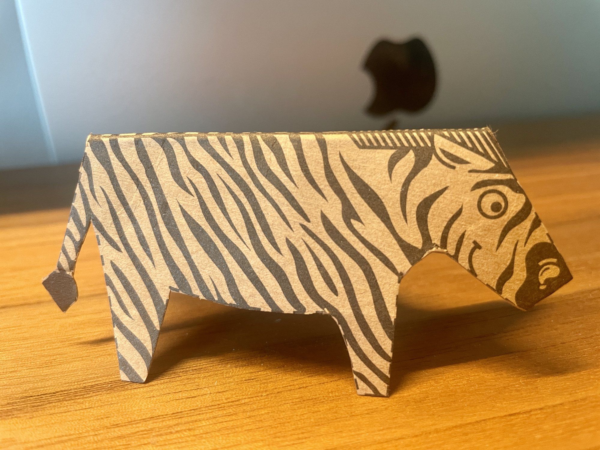 A zebra paper toy on the desk