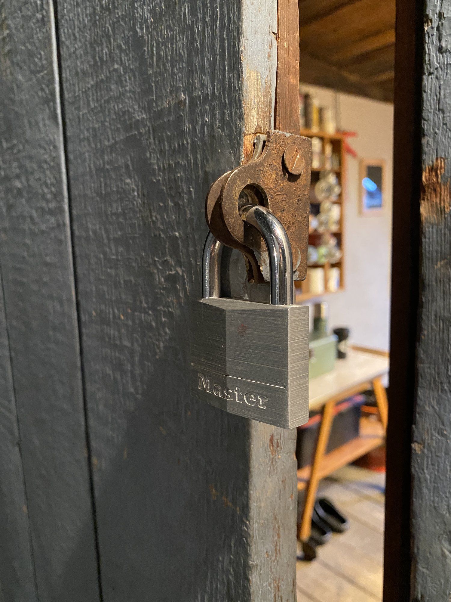 A faux padlock on the door to Zwitzh’s attic workspace