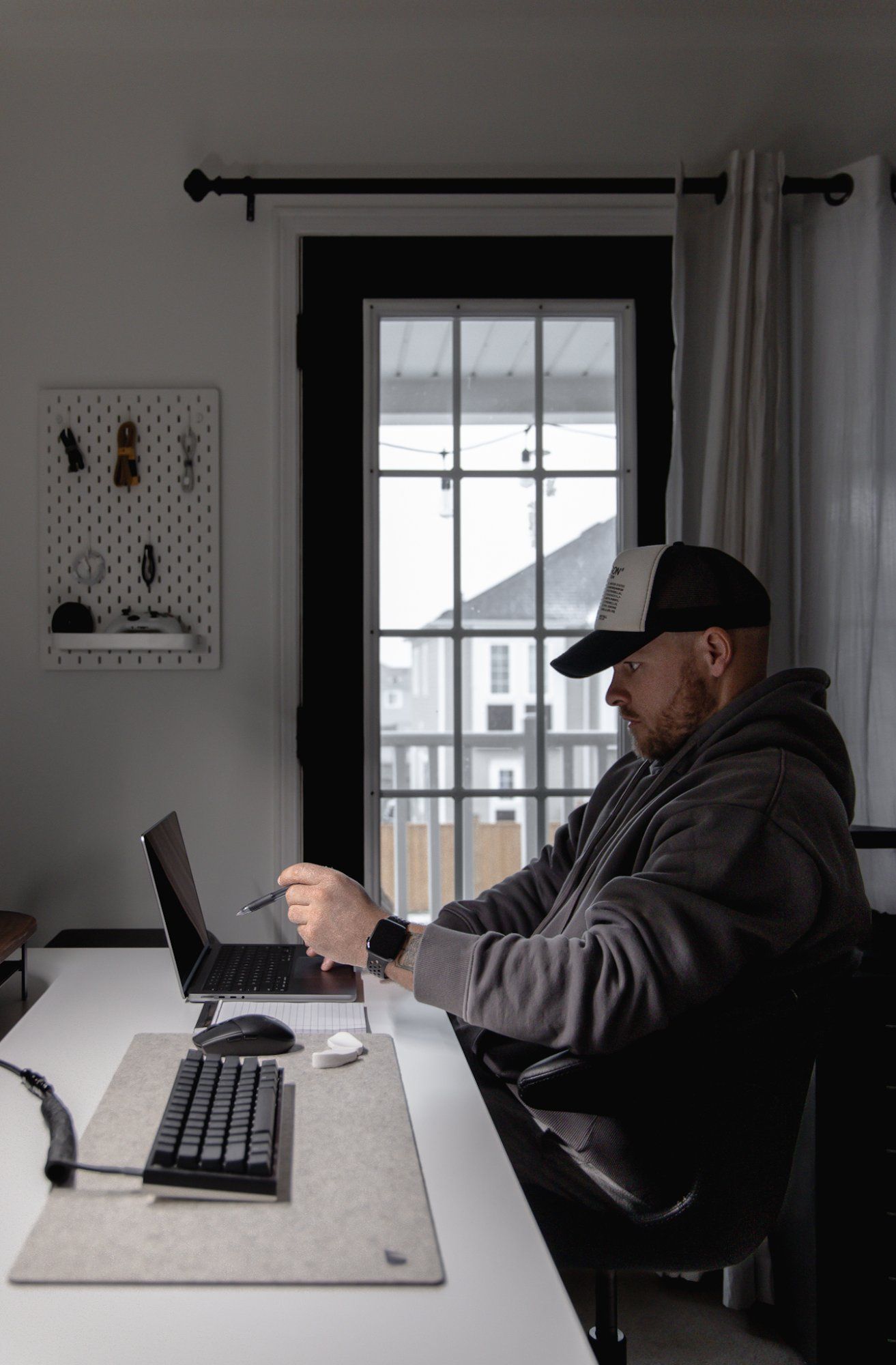 Cory Johnson in his minimal home office in Toronto, Canada