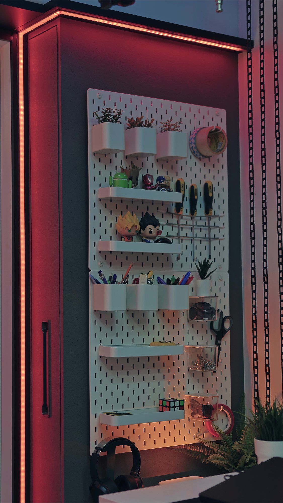 A pegboard holding stationery items and home office accessories