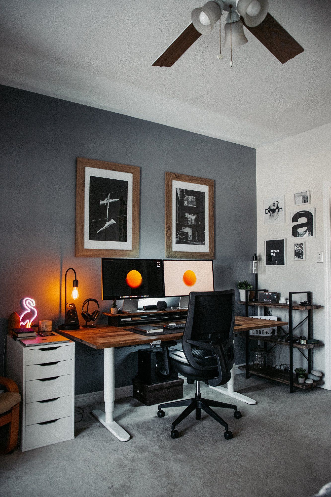 A stylish home office featuring a custom sit-stand desk with a white frame and a white IKEA ALEX drawer