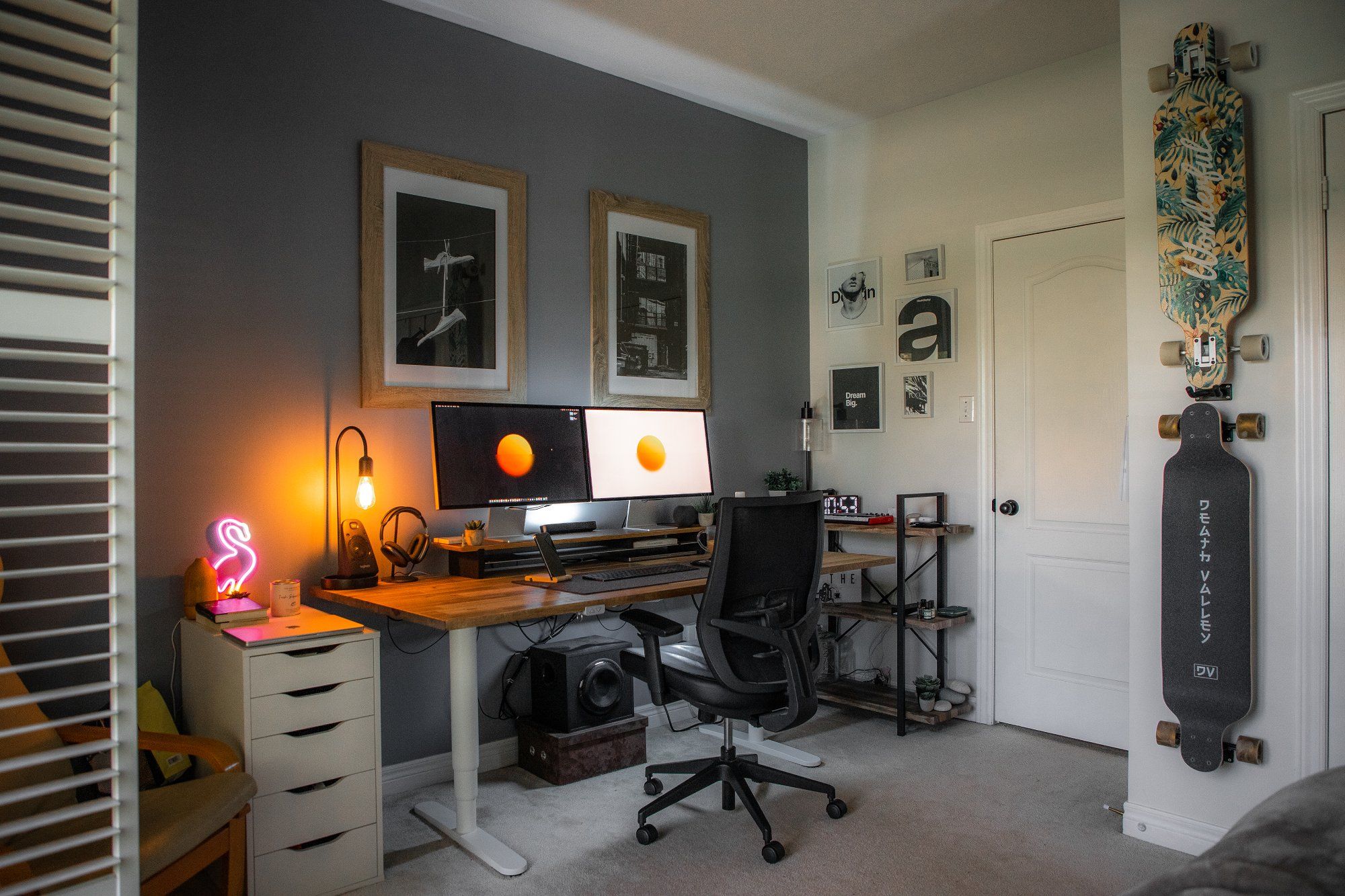 A smart designer home office includes a standing desk, ergonomic chair, dual monitors, and storage
