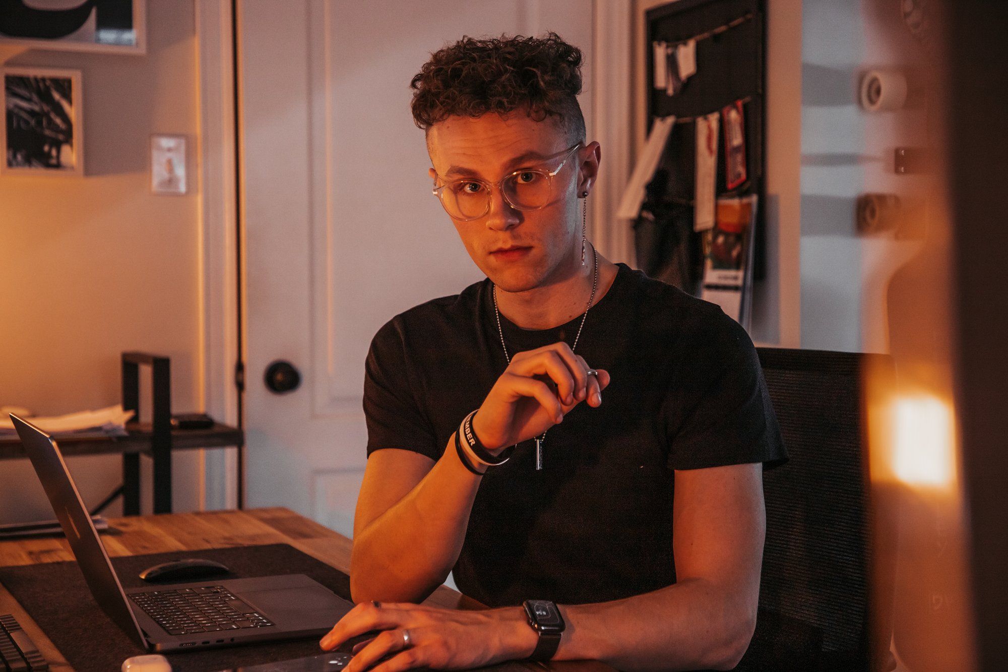 A portrait of Kevin Walton, a Canadian freelance creative professional, in their home office