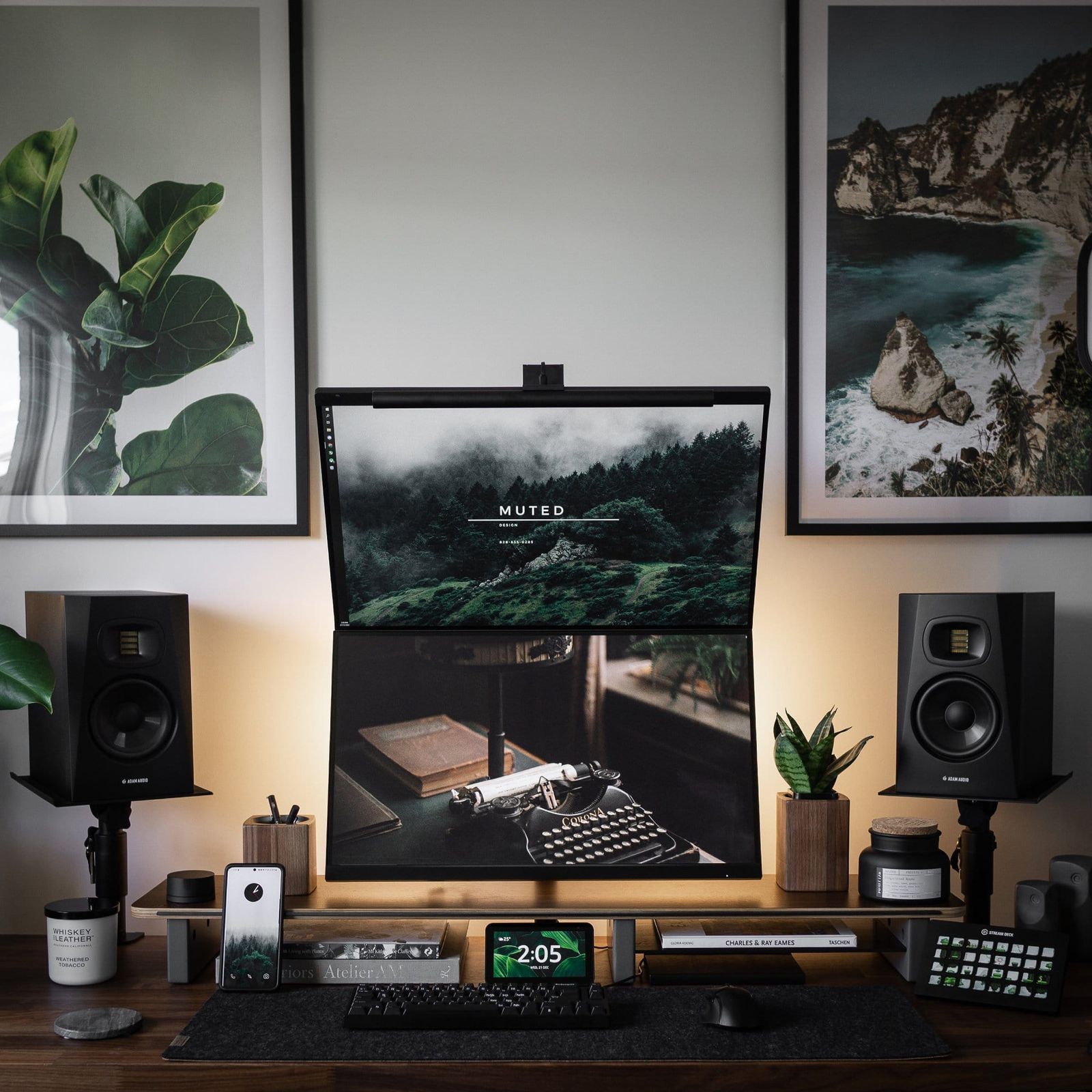 A home desk setup with two vertically stacked monitors