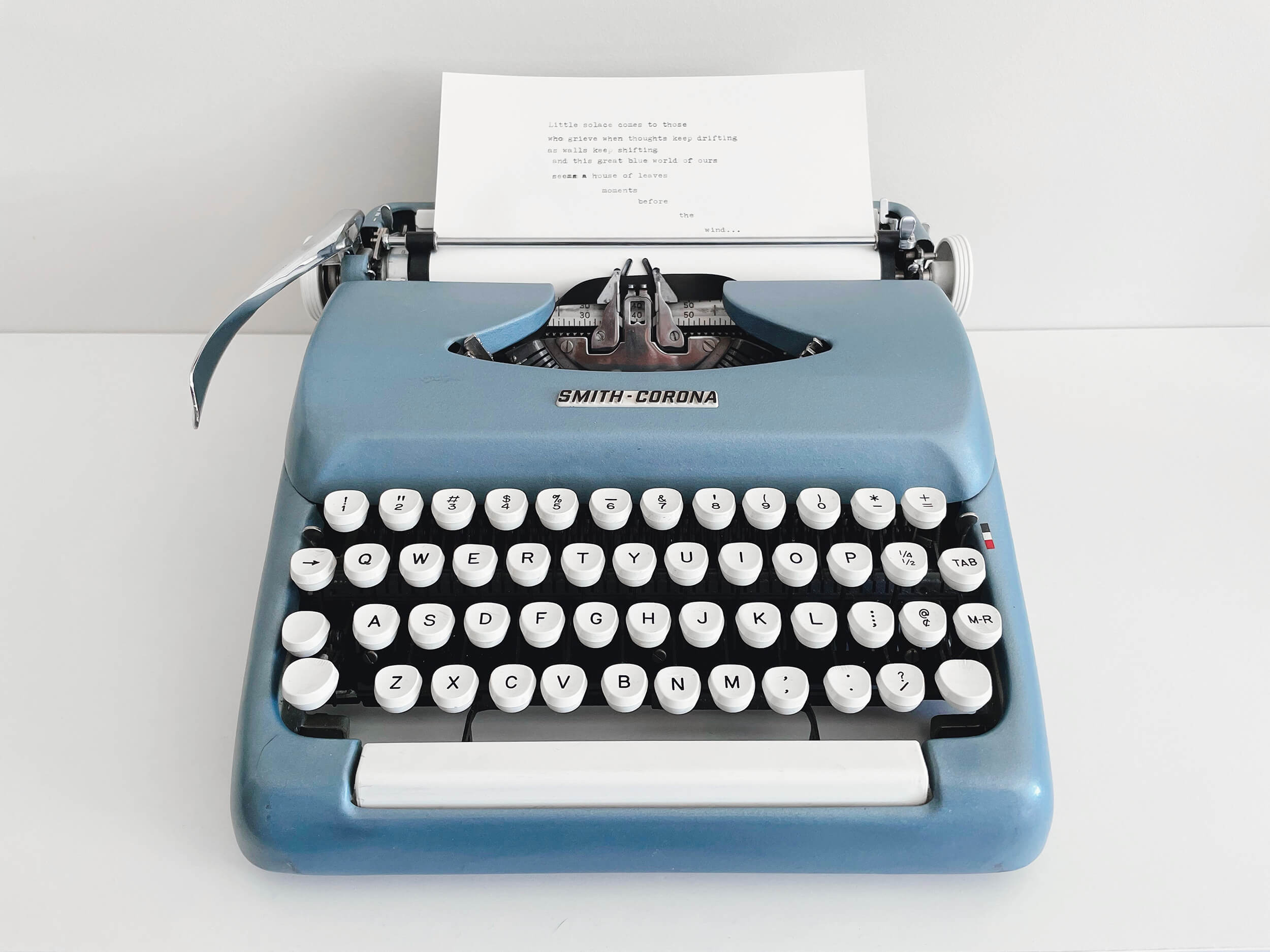 A Smith & Corona blue steel typewriter from the 1950s