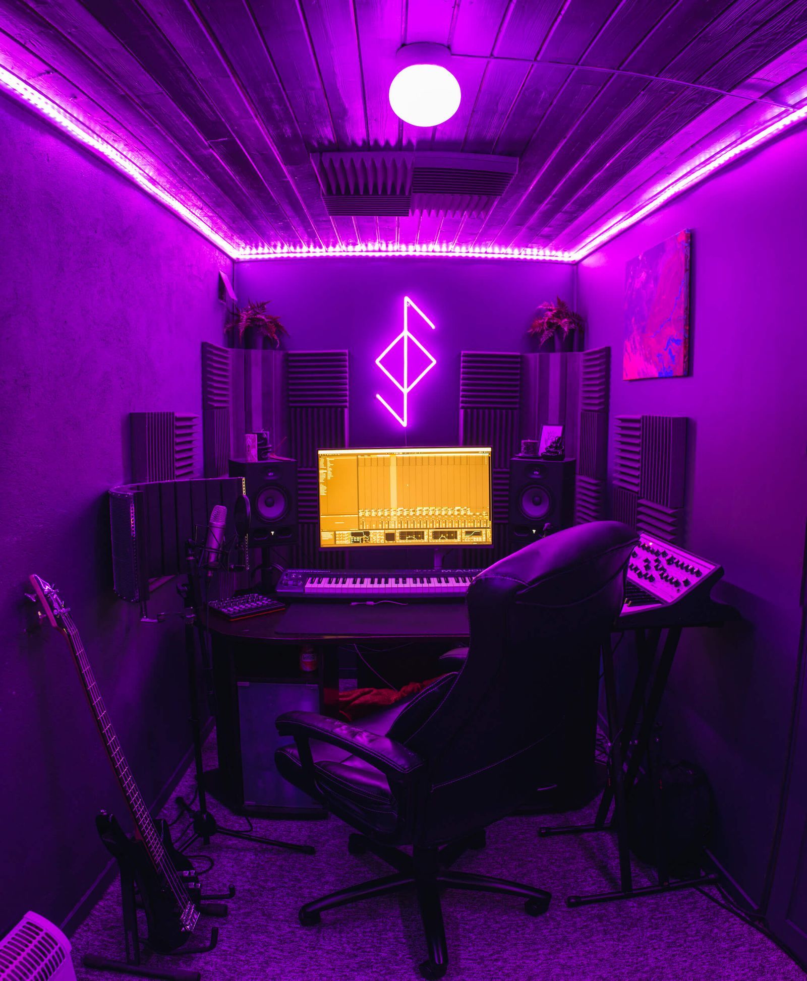 A purple music studio in a small den
