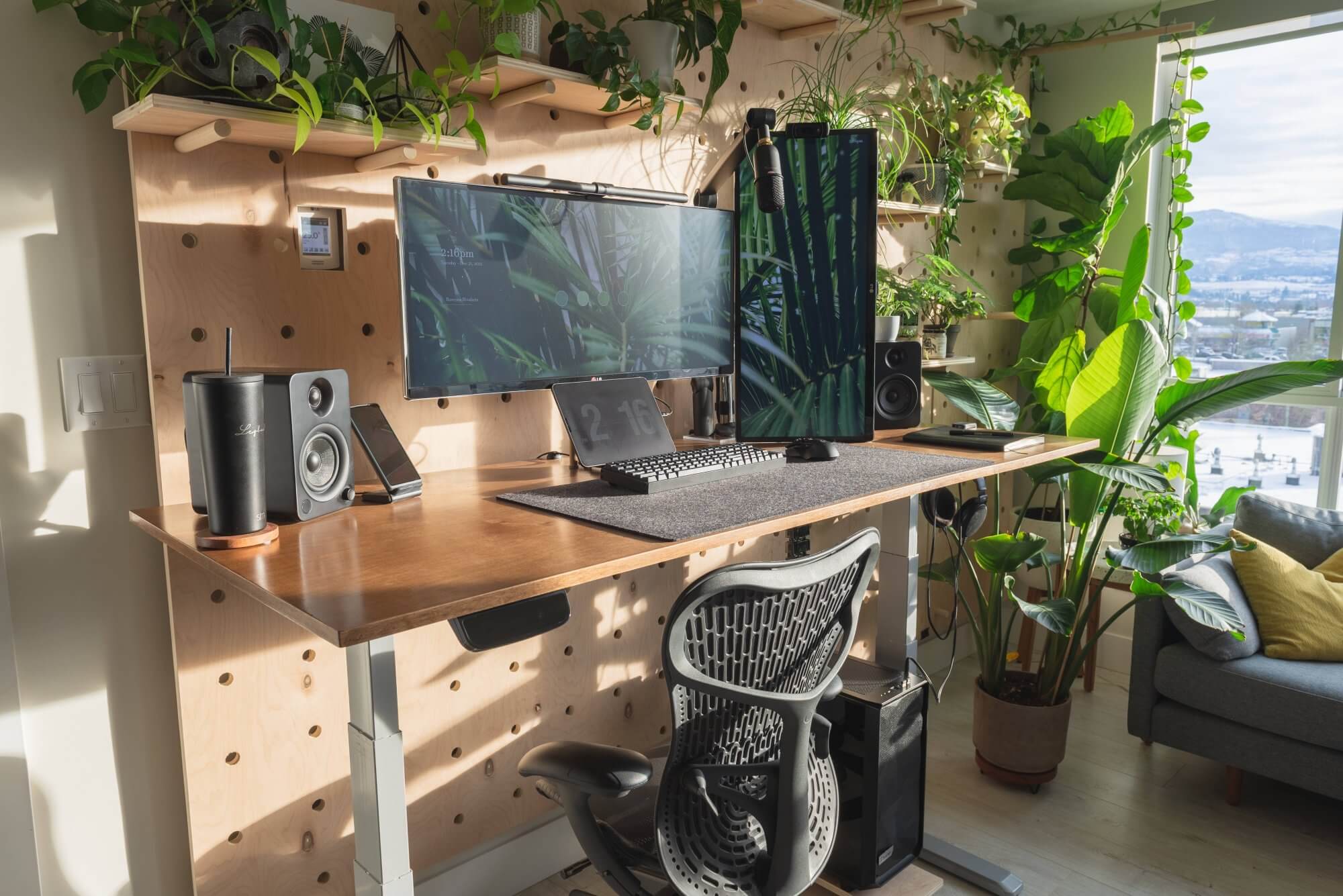 A botanical home office with a pegboard wall